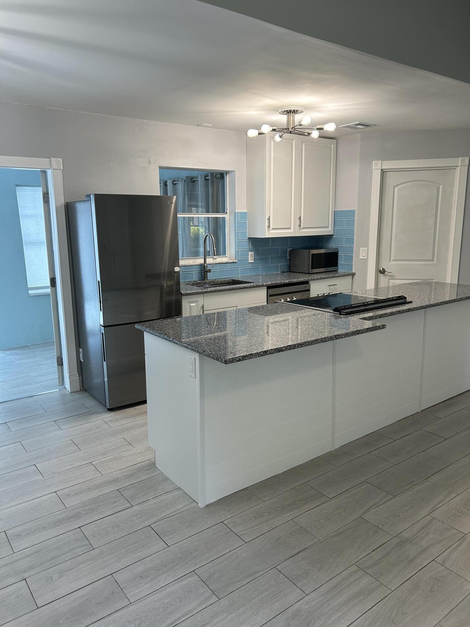 6110 Wolfe Street Jupiter, FL 33458 - Photo 3 of 8 IMG_2612