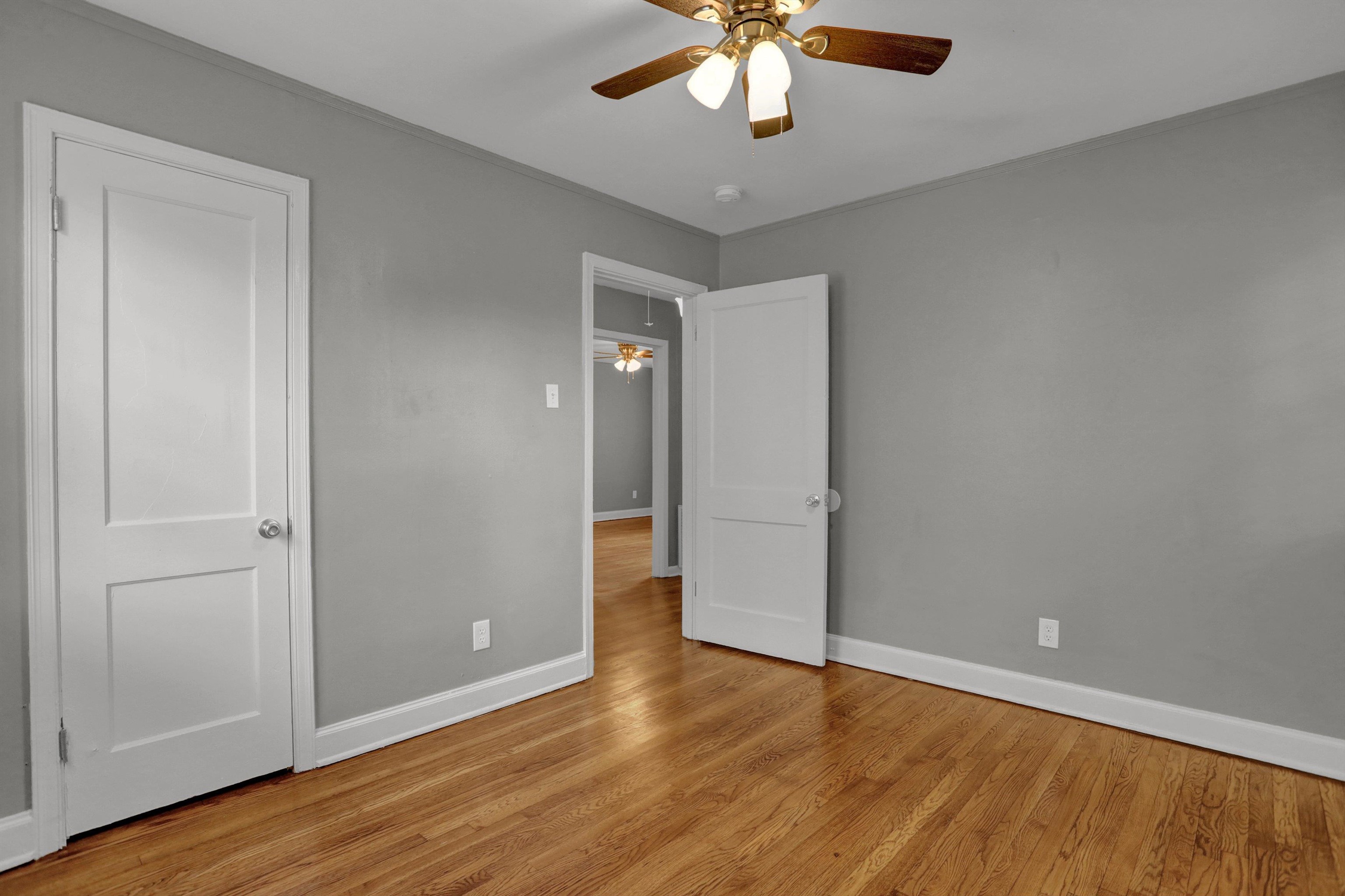 3855 South Brighton Road Memphis, TN 38128 - Photo 13 of 21 a view of an empty room with wooden floor