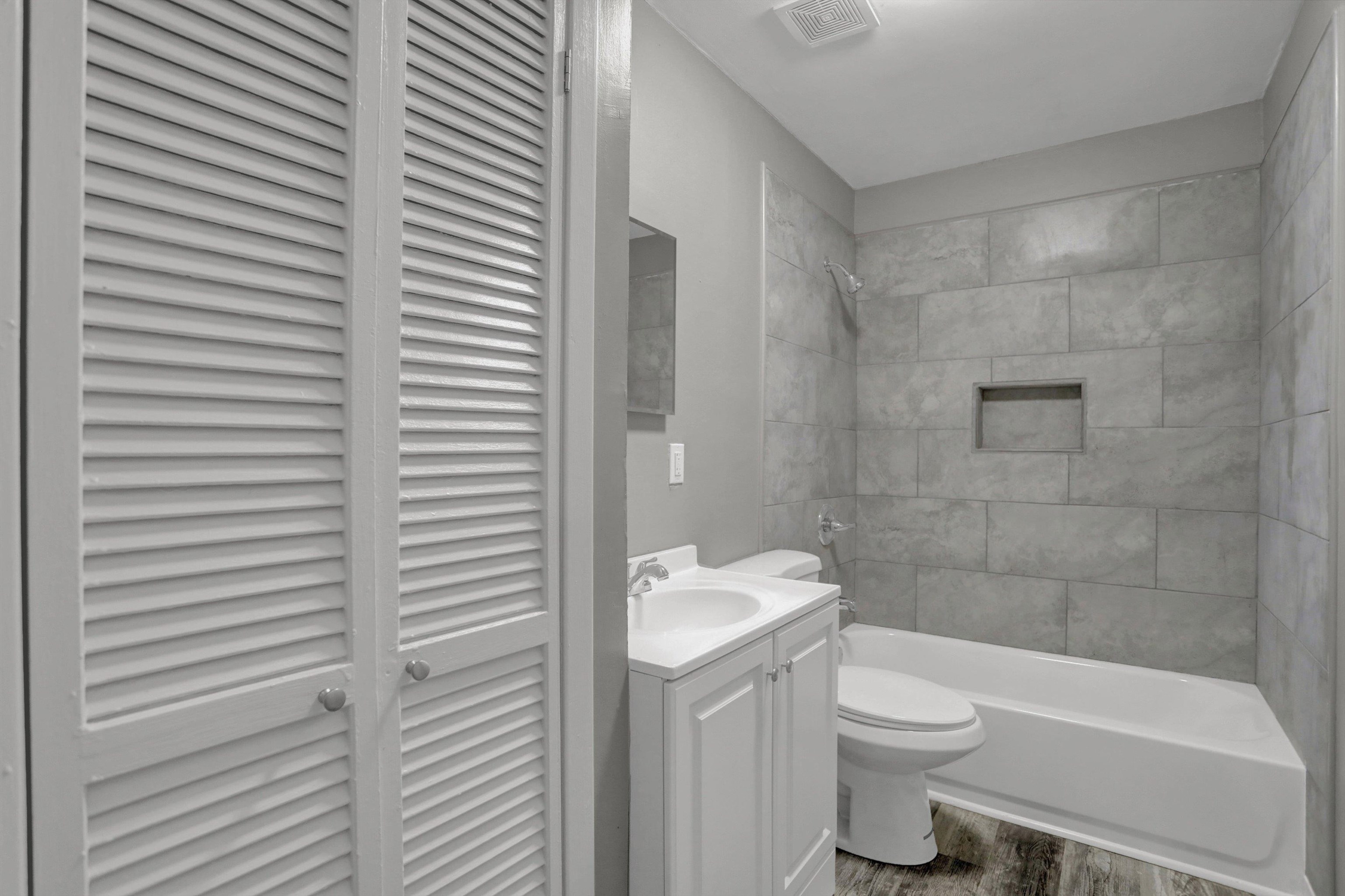 3855 South Brighton Road Memphis, TN 38128 - Photo 14 of 21 a bathroom with a toilet a sink and shower