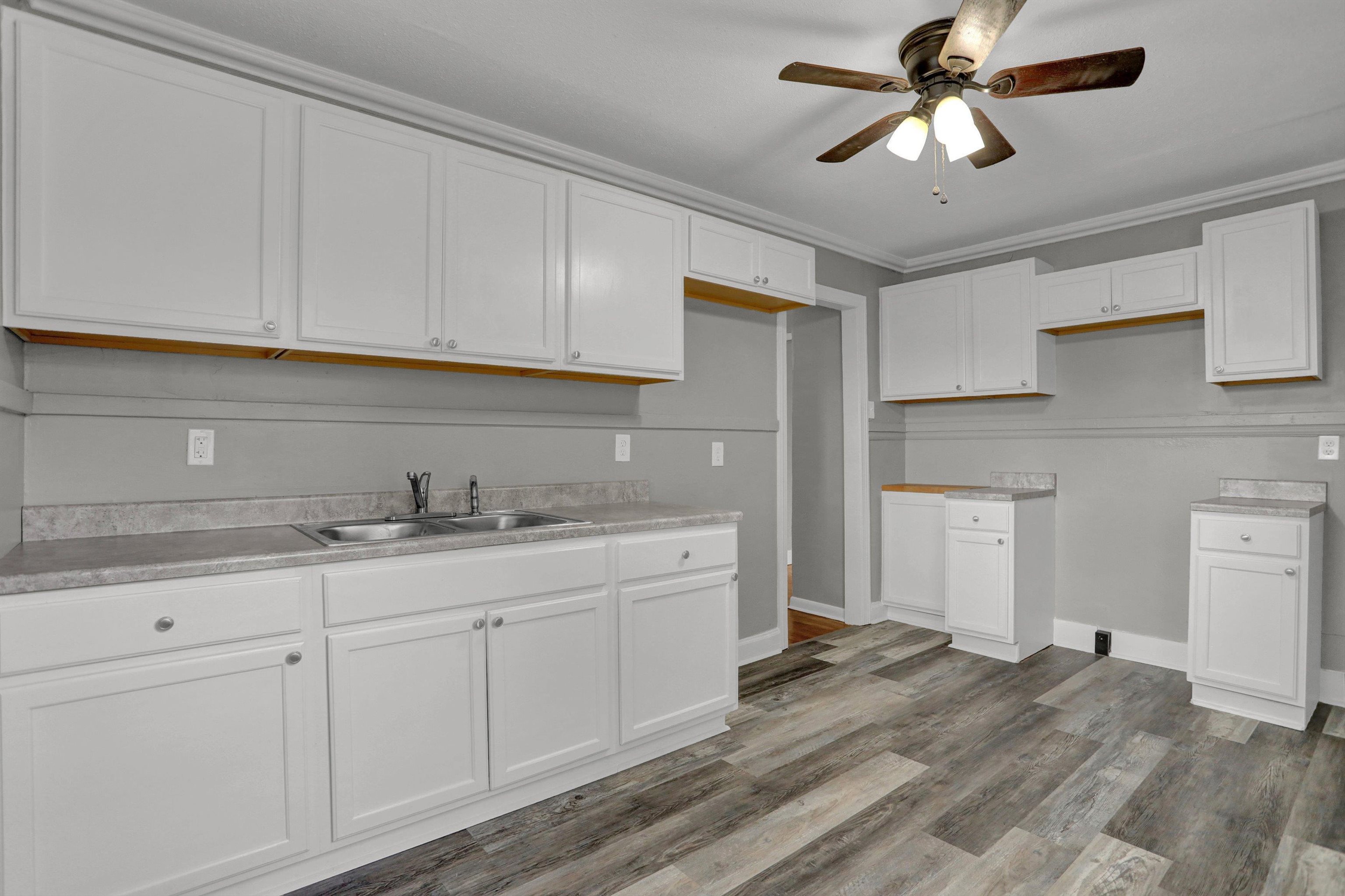 3855 South Brighton Road Memphis, TN 38128 - Photo 10 of 21 a kitchen with a sink dishwasher and white cabinets