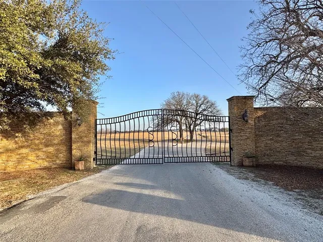 a view of a wrought iron fences in front of house