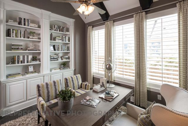 a view of a dining room with furniture and a window