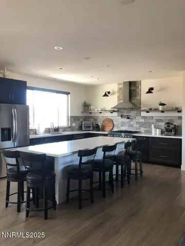 a kitchen with a table and chairs in it