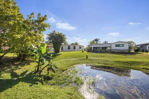 a view of a house with a big yard