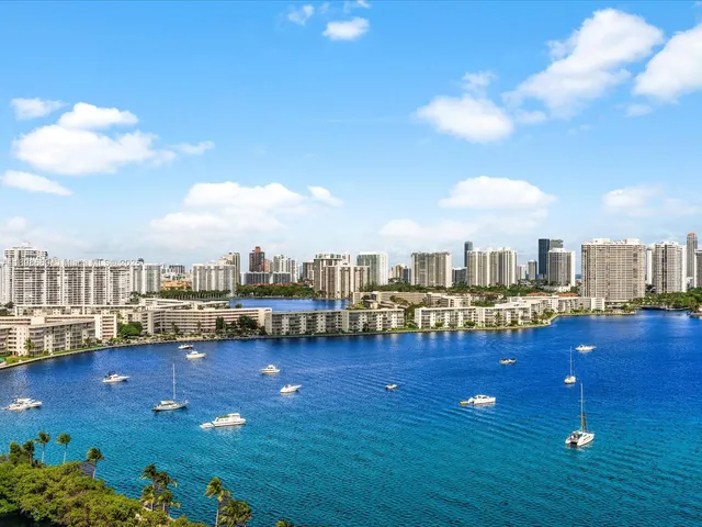 a living room with furniture and view of kitchen