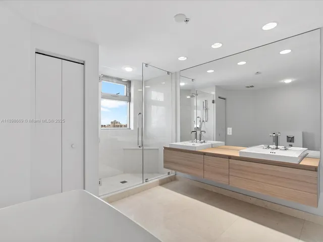 a bathroom with a bathtub and a shower