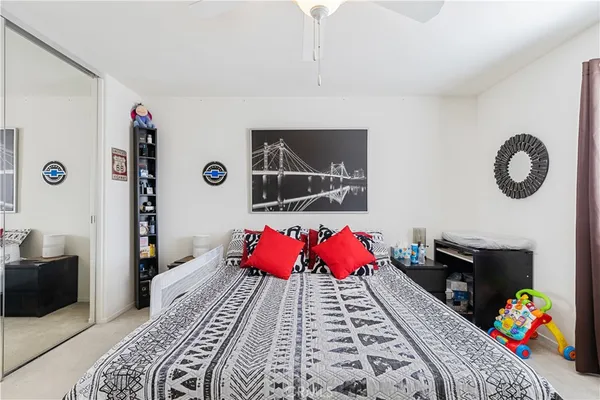 a bedroom with a bed and a couch