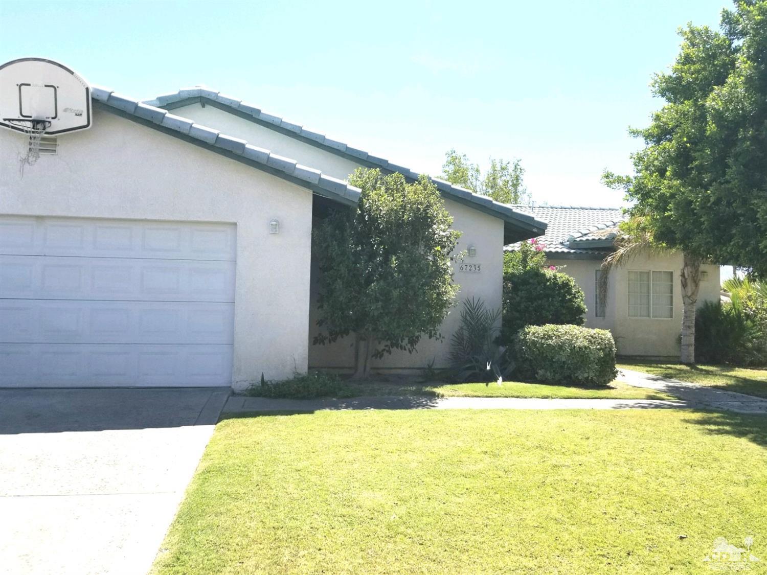 67235 Ovante Road Cathedral City, CA 92234 - Photo 1 of 16 a view of a house with a backyard