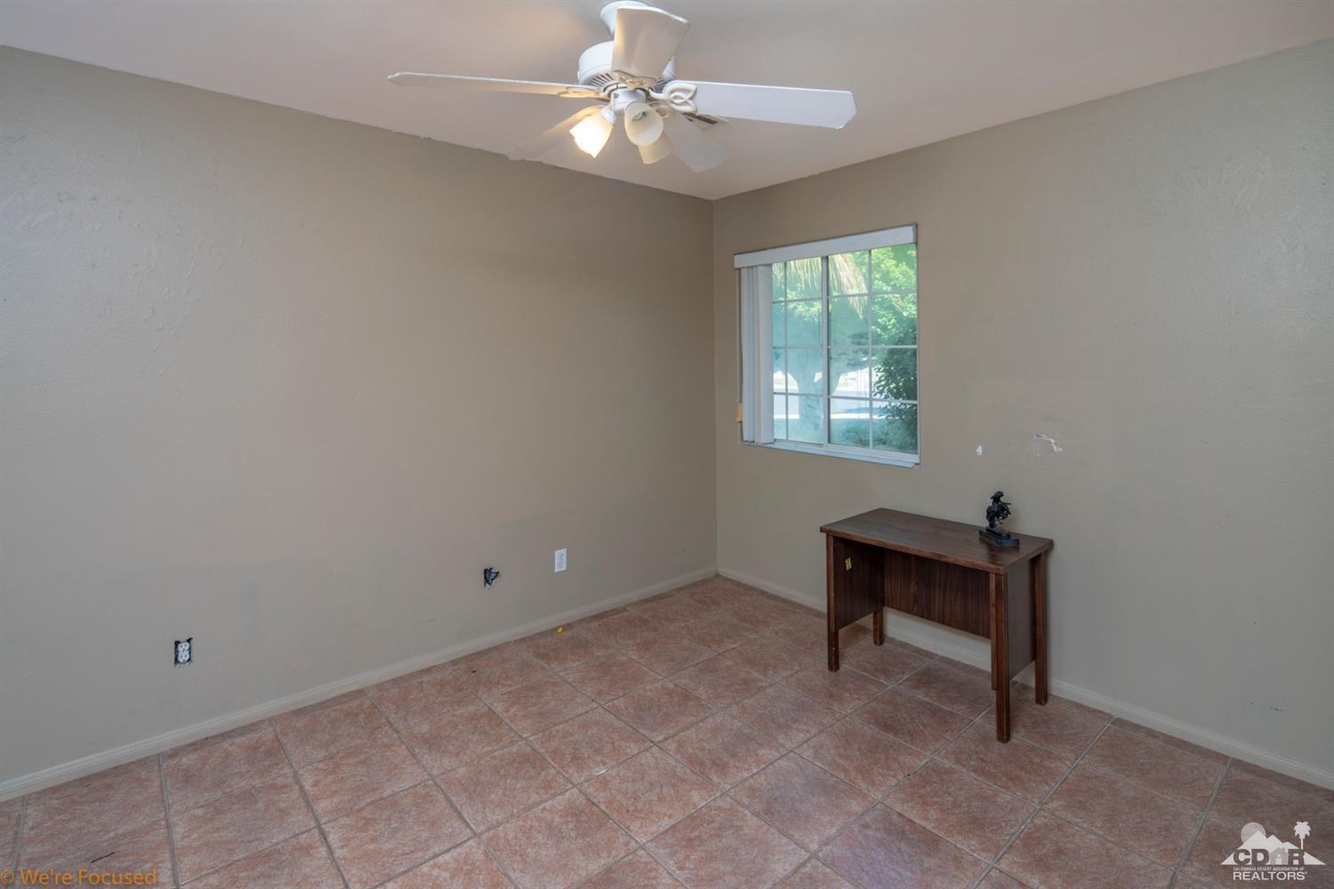67235 Ovante Road Cathedral City, CA 92234 - Photo 13 of 16 a view of an empty room with a window