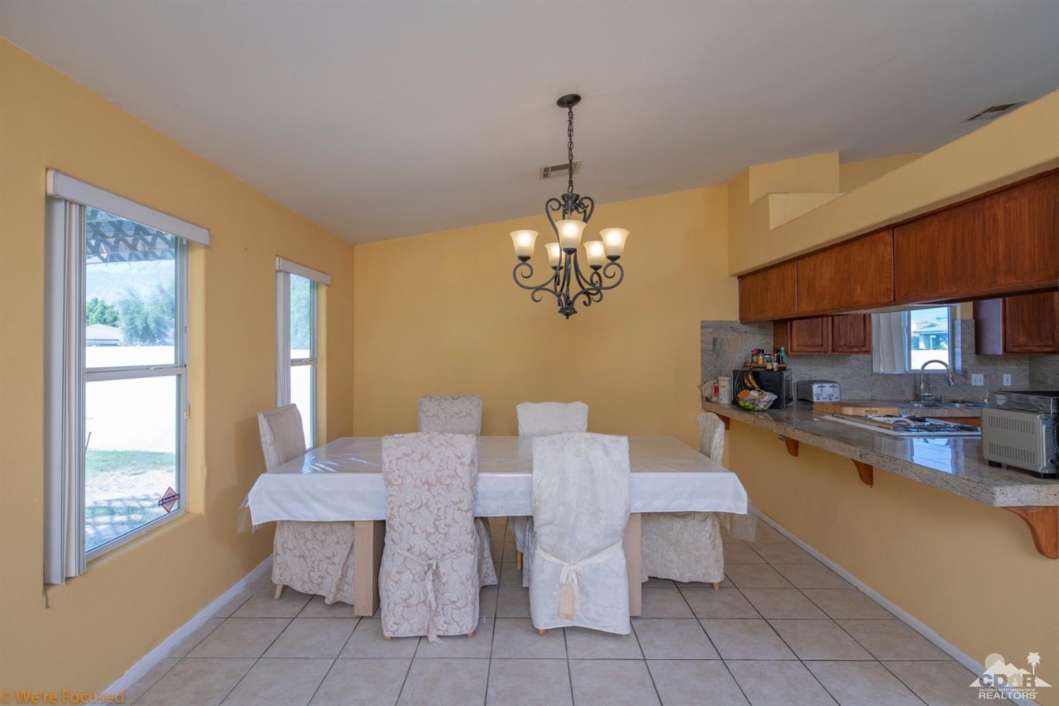 67235 Ovante Road Cathedral City, CA 92234 - Photo 15 of 16 a view of a dining room with furniture window and outside view