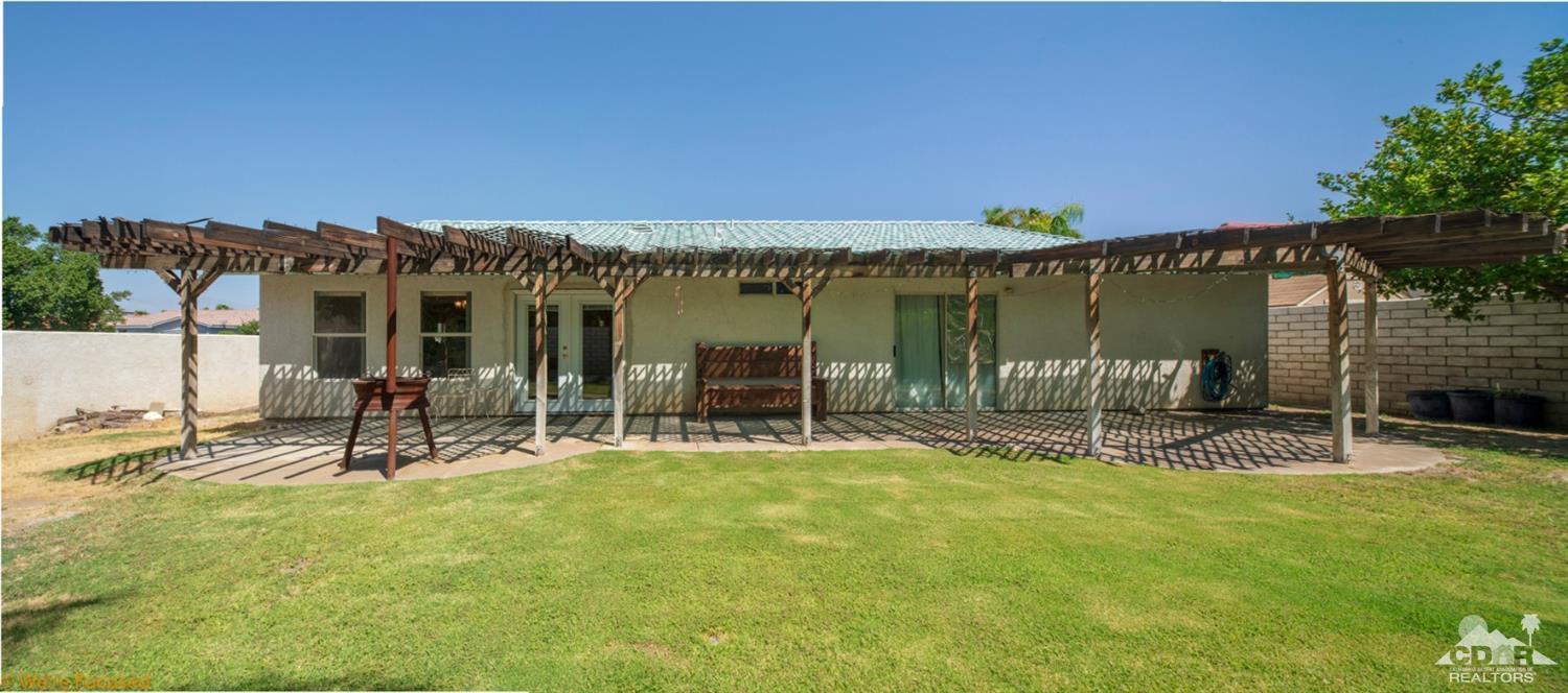 67235 Ovante Road Cathedral City, CA 92234 - Photo 4 of 16 a view of a patio with a table and chairs
