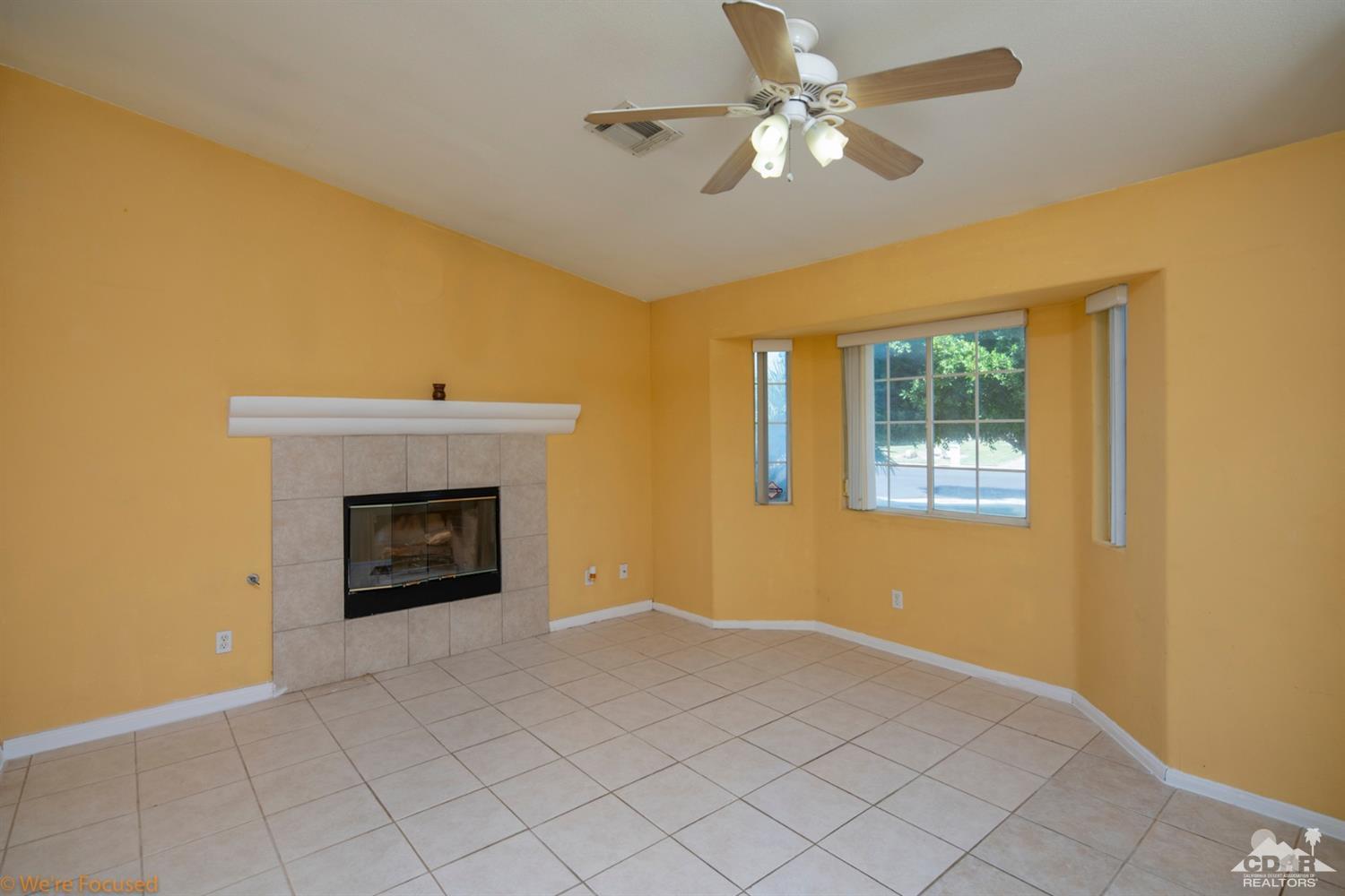 67235 Ovante Road Cathedral City, CA 92234 - Photo 5 of 16 a view of an empty room with a fireplace