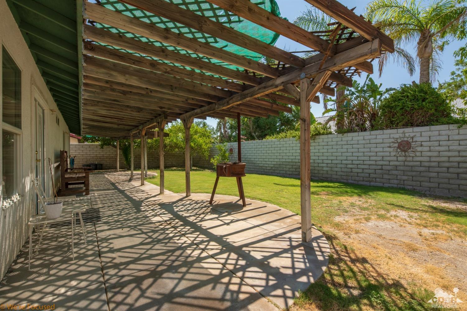 67235 Ovante Road Cathedral City, CA 92234 - Photo 7 of 16 a view of a swimming pool with a patio