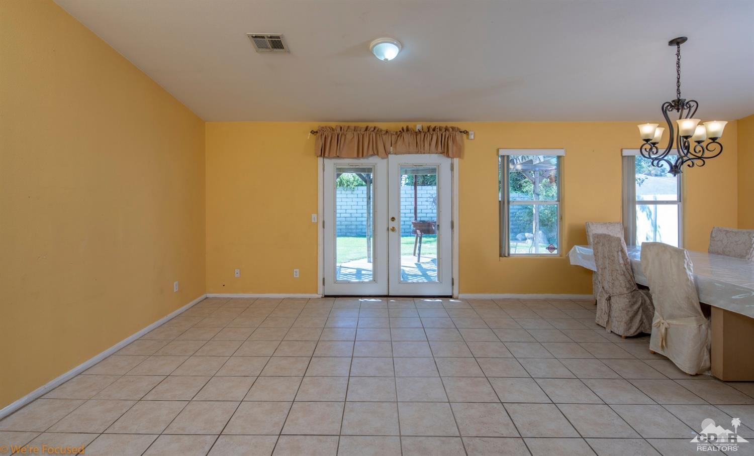 67235 Ovante Road Cathedral City, CA 92234 - Photo 9 of 16 a view of an empty room with a window