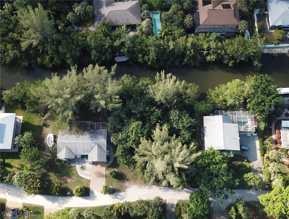5847 Pine Tree Drive Sanibel, FL 33957 - Photo 18 of 20 an aerial view of a house with a yard and garden