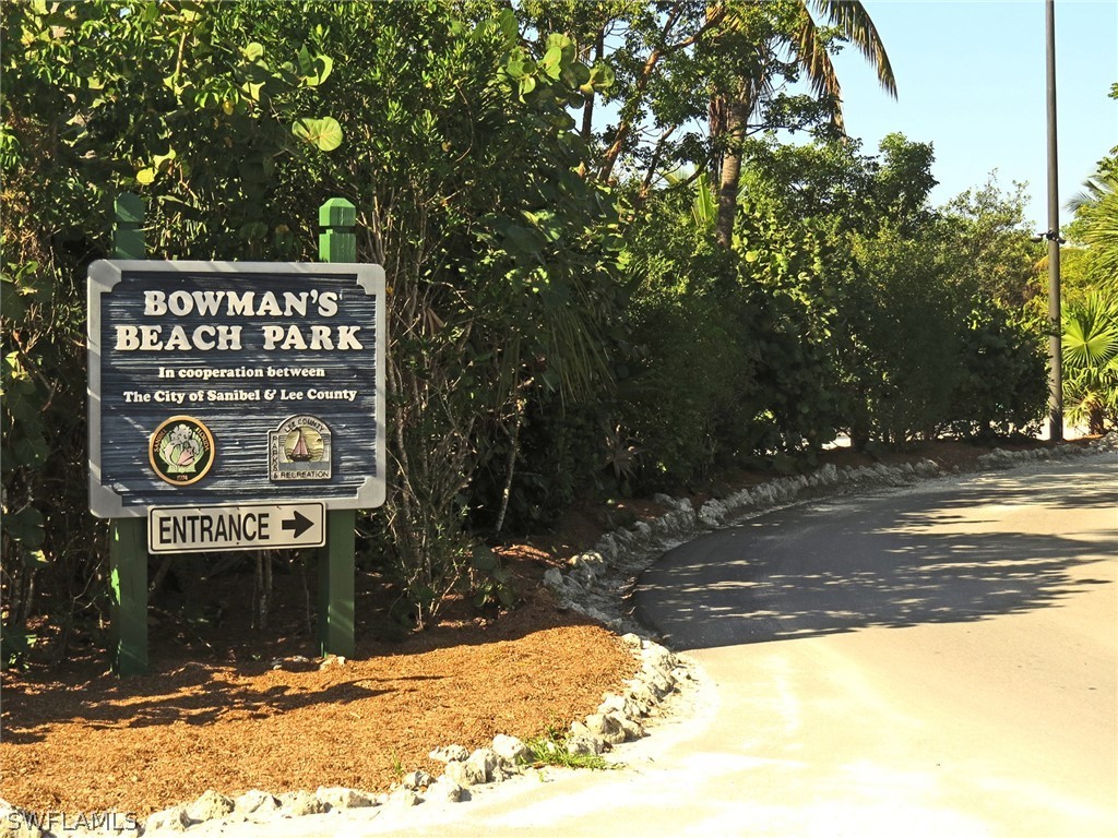 5847 Pine Tree Drive Sanibel, FL 33957 - Photo 4 of 20 a view of a street sign under a large tree