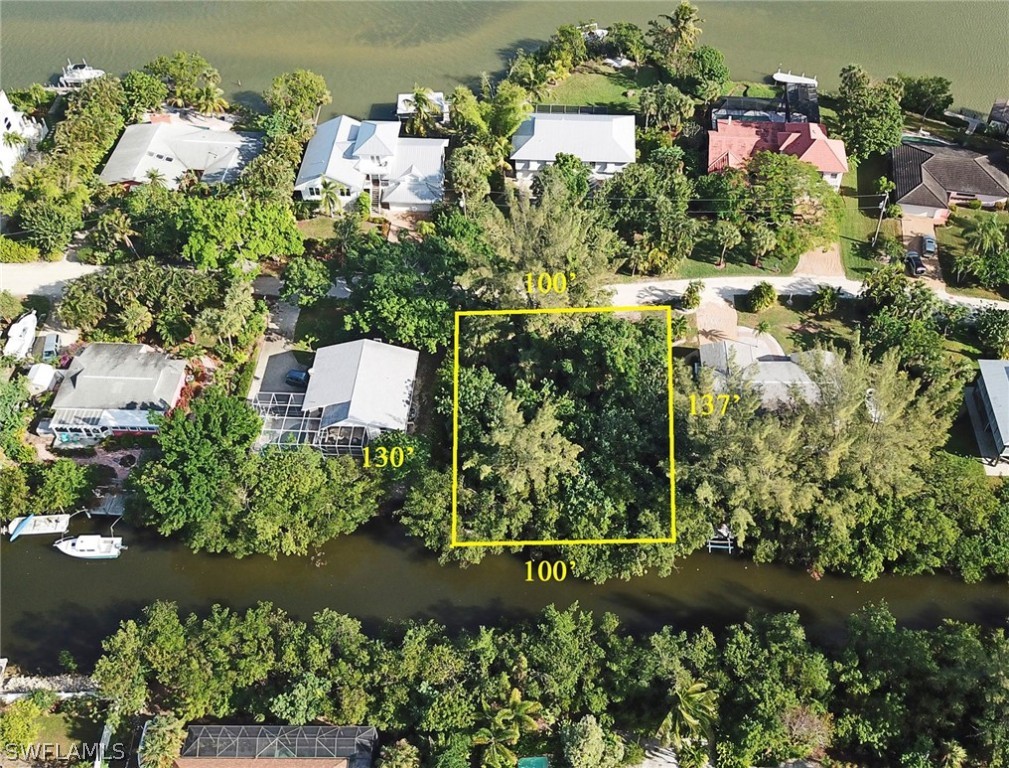 5847 Pine Tree Drive Sanibel, FL 33957 - Photo 5 of 20 an aerial view of a house with a yard