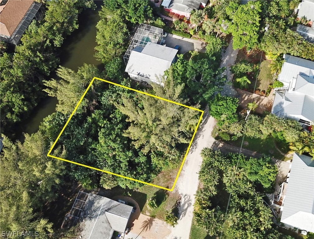 5847 Pine Tree Drive Sanibel, FL 33957 - Photo 6 of 20 an aerial view of a house with a yard and sitting area