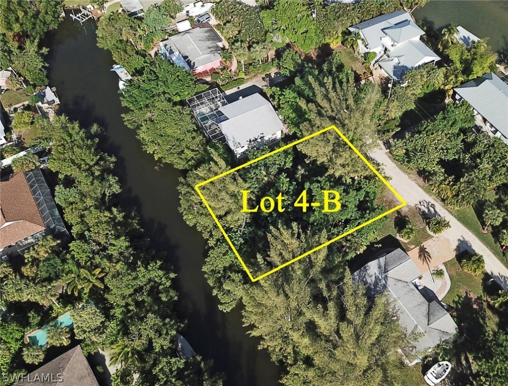 5847 Pine Tree Drive Sanibel, FL 33957 - Photo 8 of 20 an aerial view of a residential houses with yard