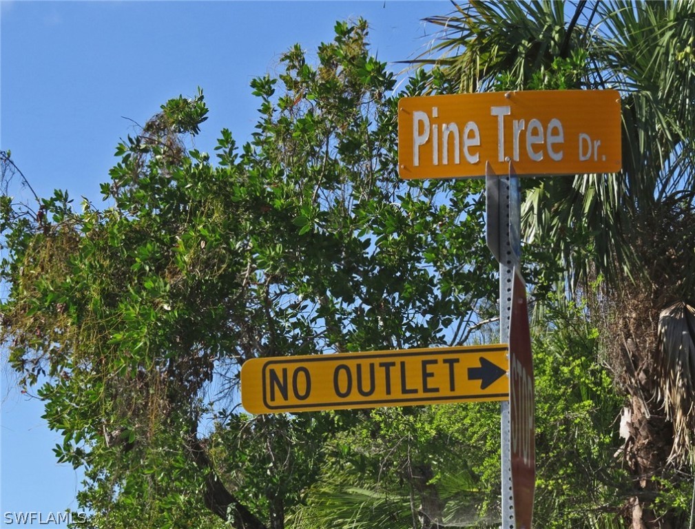5847 Pine Tree Drive Sanibel, FL 33957 - Photo 10 of 20 a sign broad on the side of the road
