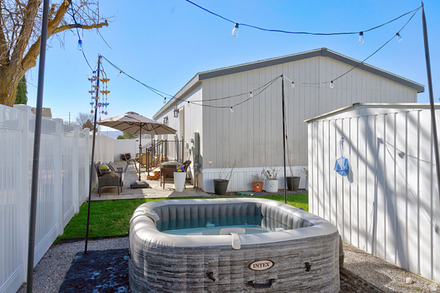 502 West 725 North Logan, UT 84321 - Photo 21 of 25 Exterior space with a patio area and a hot tub