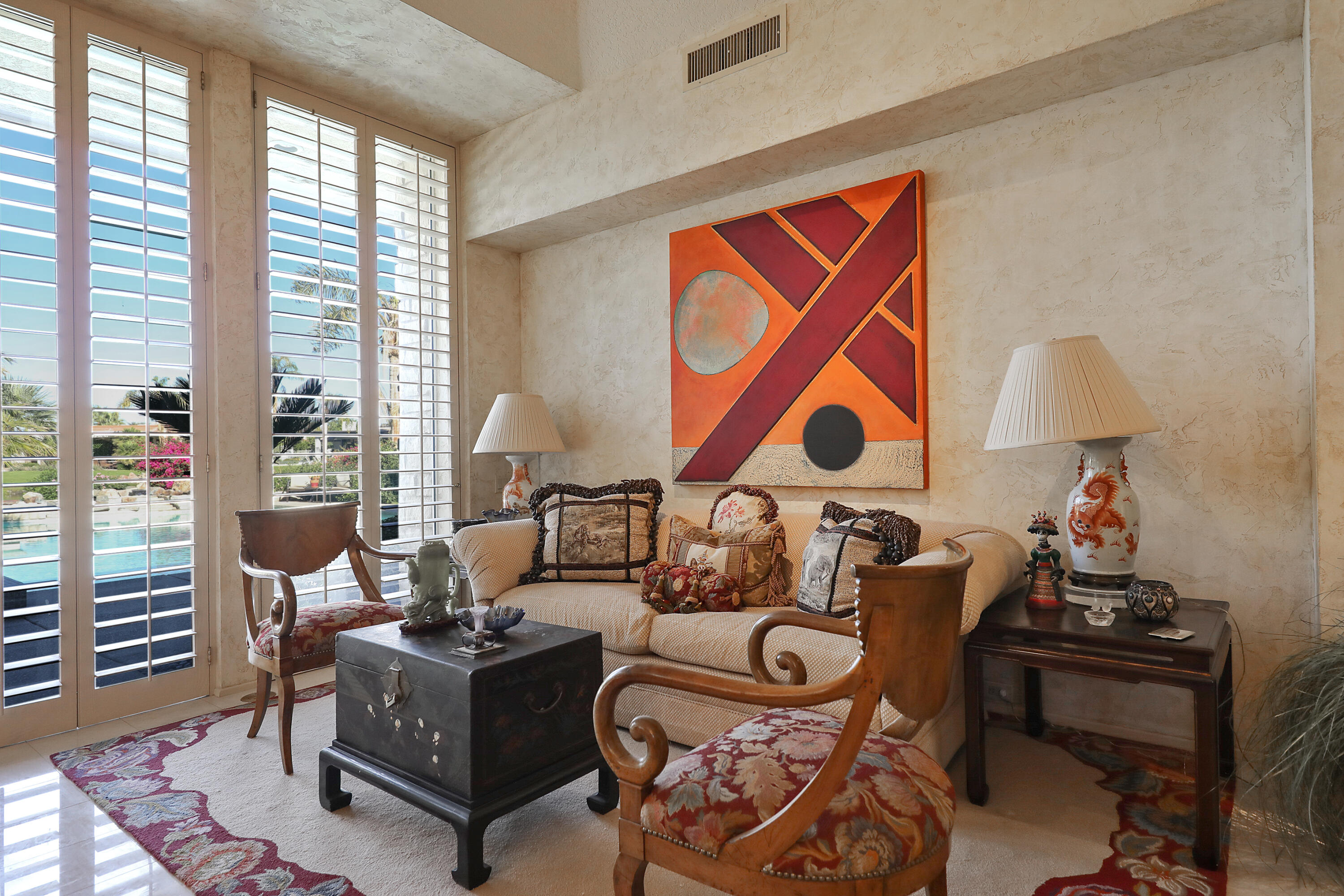 44 Fincher Way Rancho Mirage, CA 92270 - Photo 11 of 56 a living room with furniture a rug and a floor to ceiling window