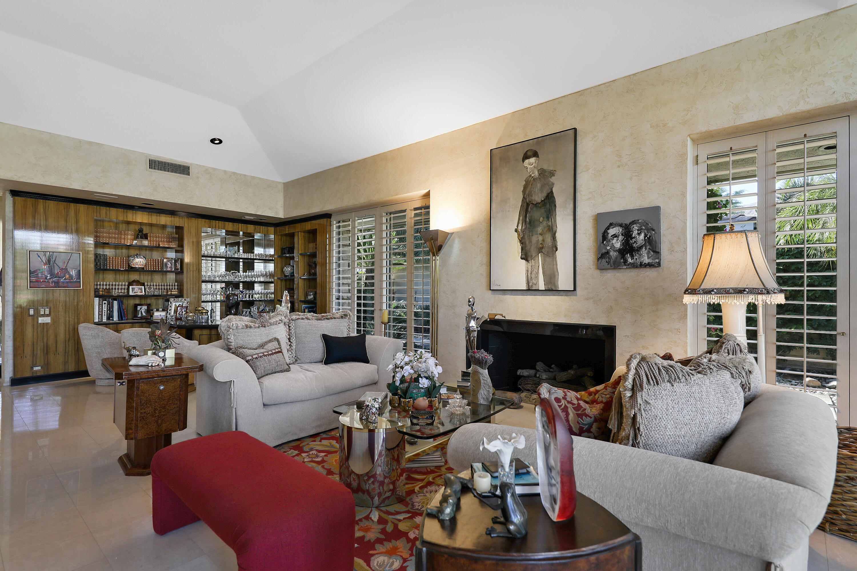 44 Fincher Way Rancho Mirage, CA 92270 - Photo 12 of 56 a living room with furniture large window and fireplace