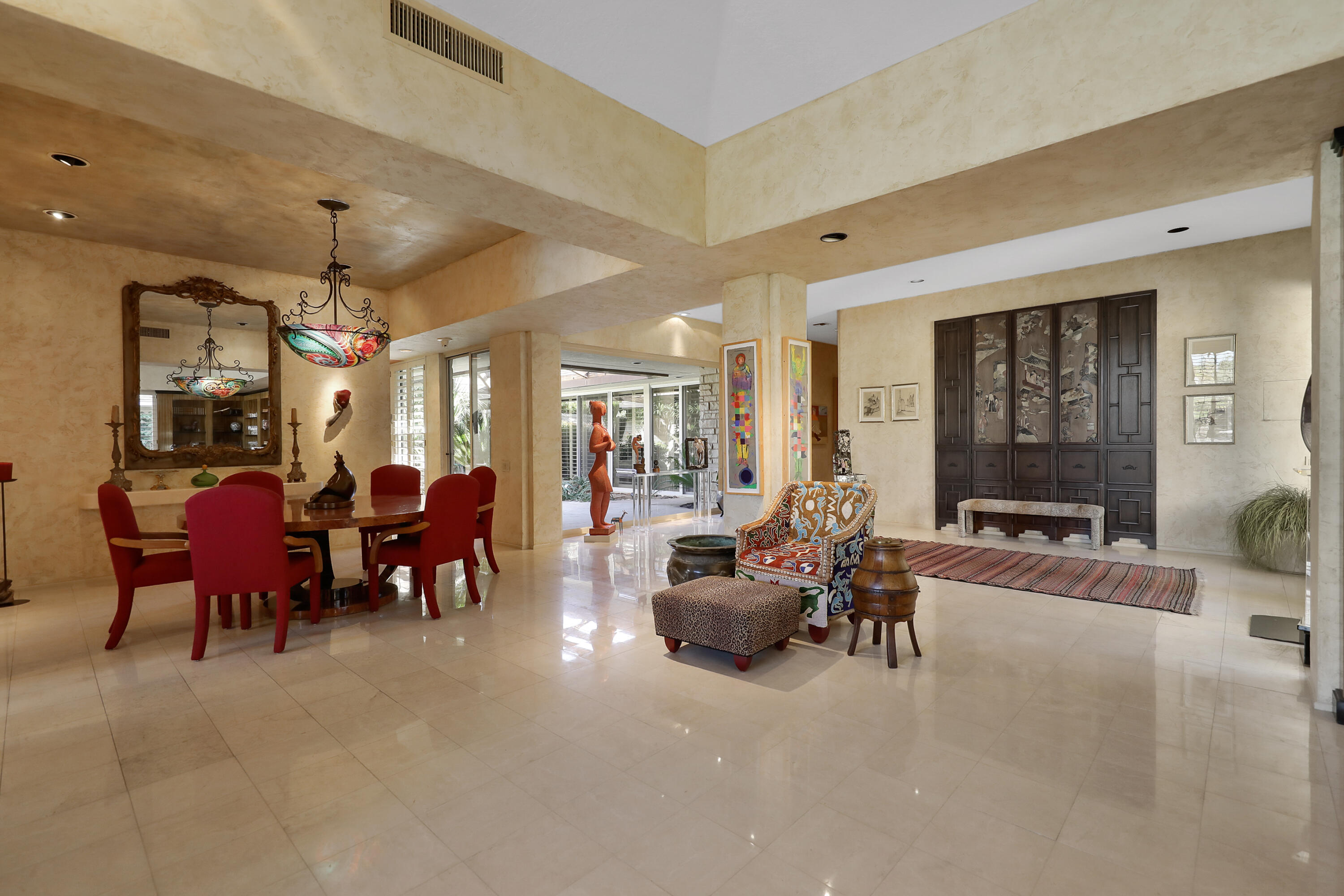 44 Fincher Way Rancho Mirage, CA 92270 - Photo 16 of 56 a living room with furniture a chandelier and a large window