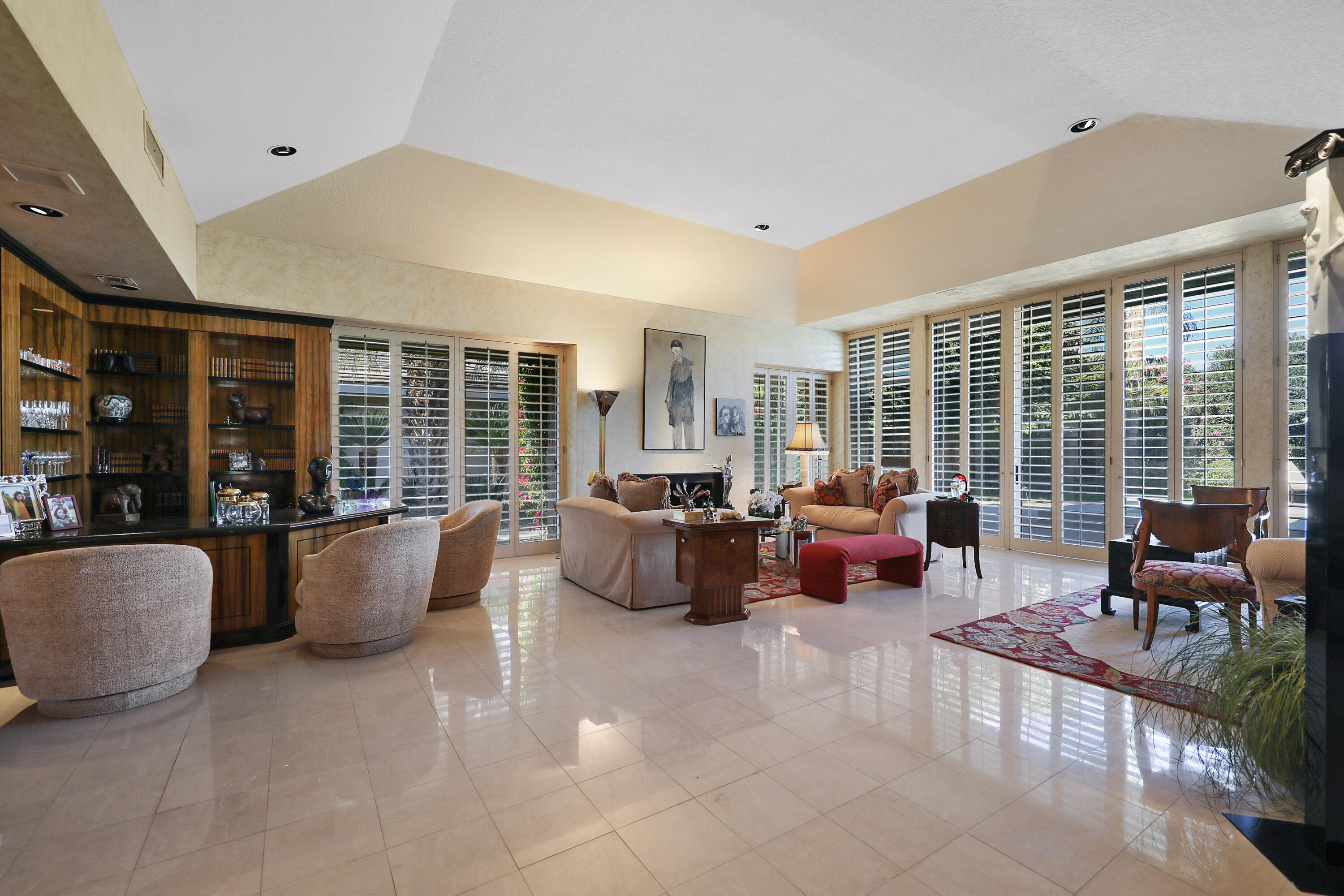 44 Fincher Way Rancho Mirage, CA 92270 - Photo 19 of 56 a living room with furniture and large windows