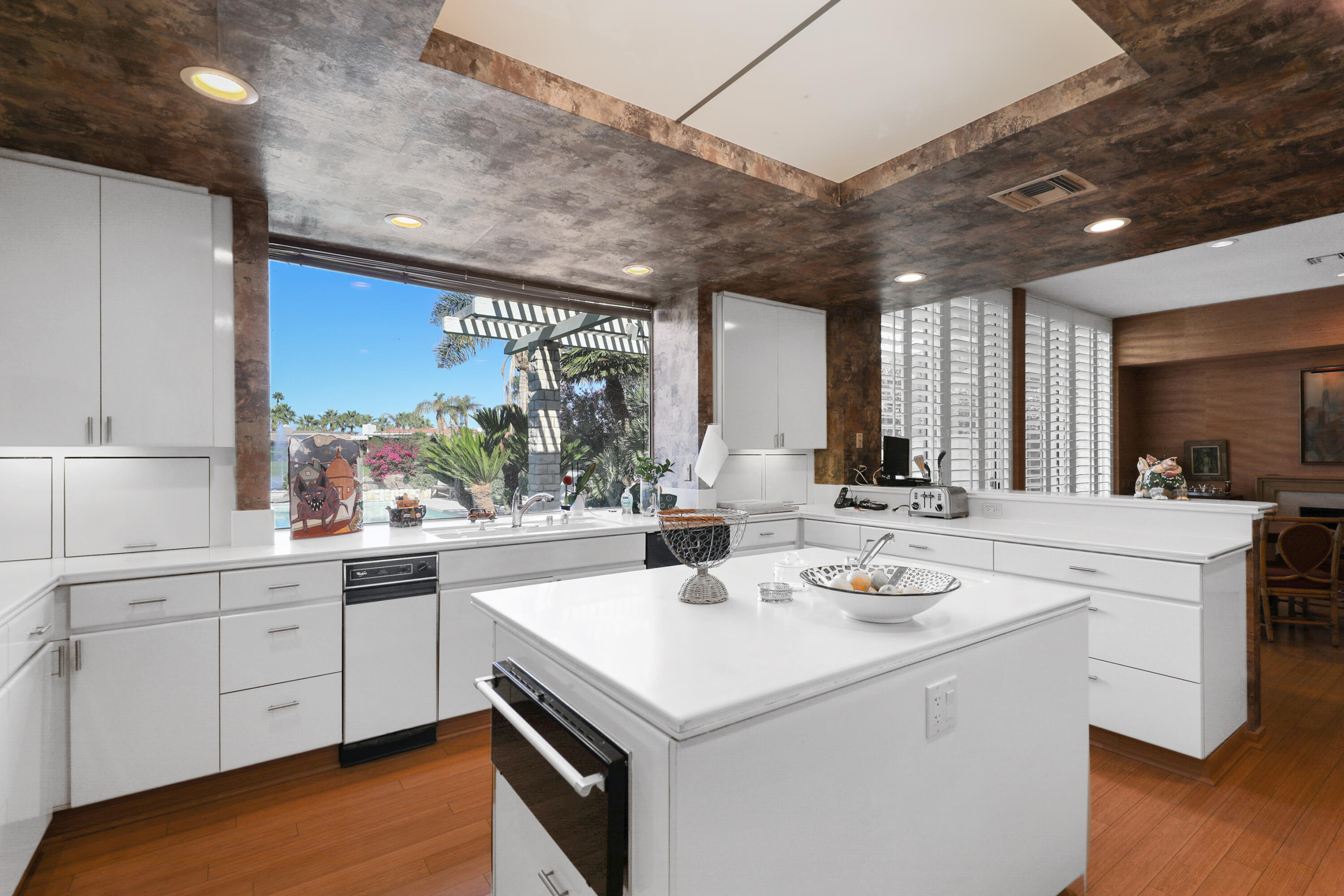 44 Fincher Way Rancho Mirage, CA 92270 - Photo 21 of 56 a kitchen with a sink a stove and cabinets