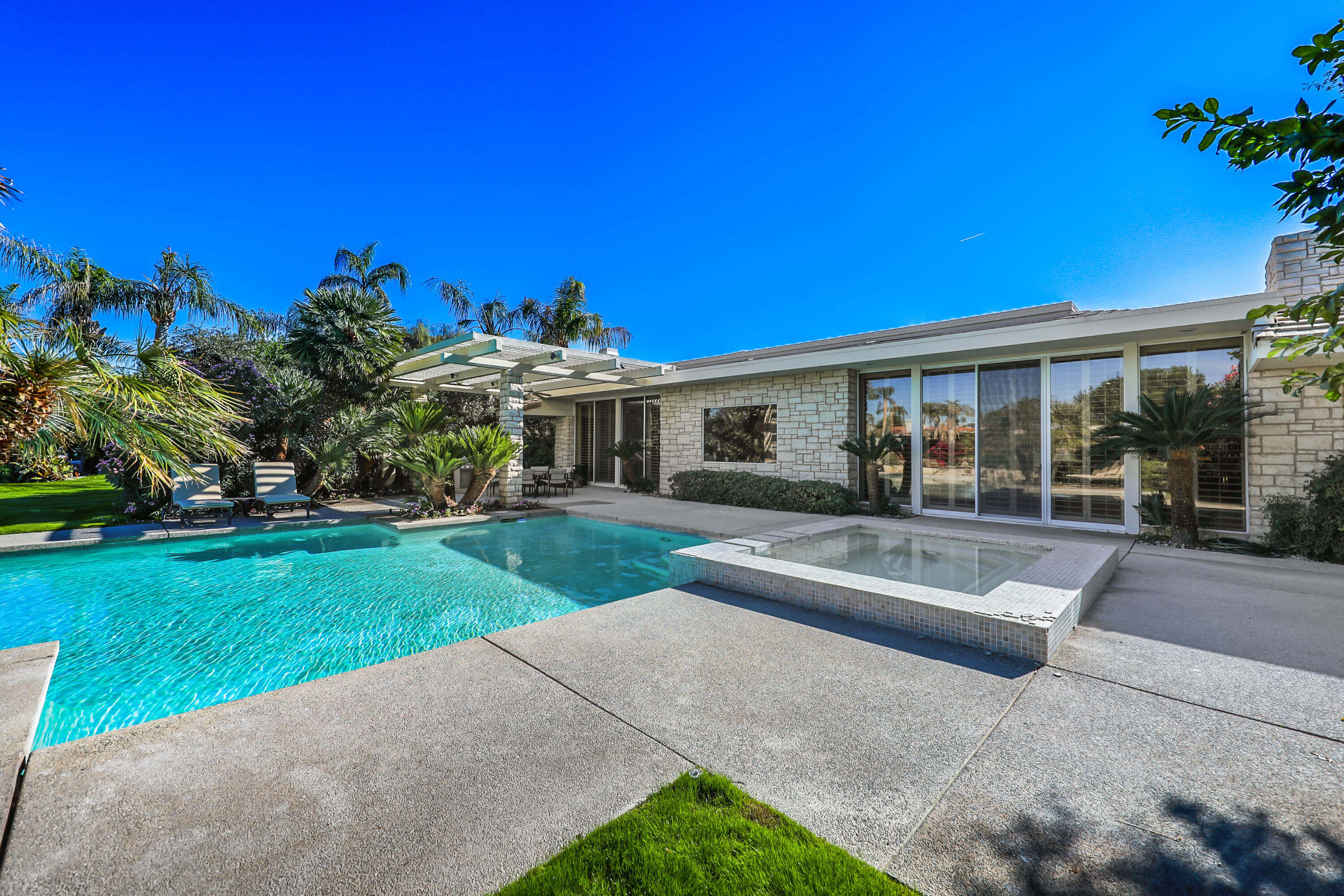 44 Fincher Way Rancho Mirage, CA 92270 - Photo 42 of 56 a view of a house with a yard