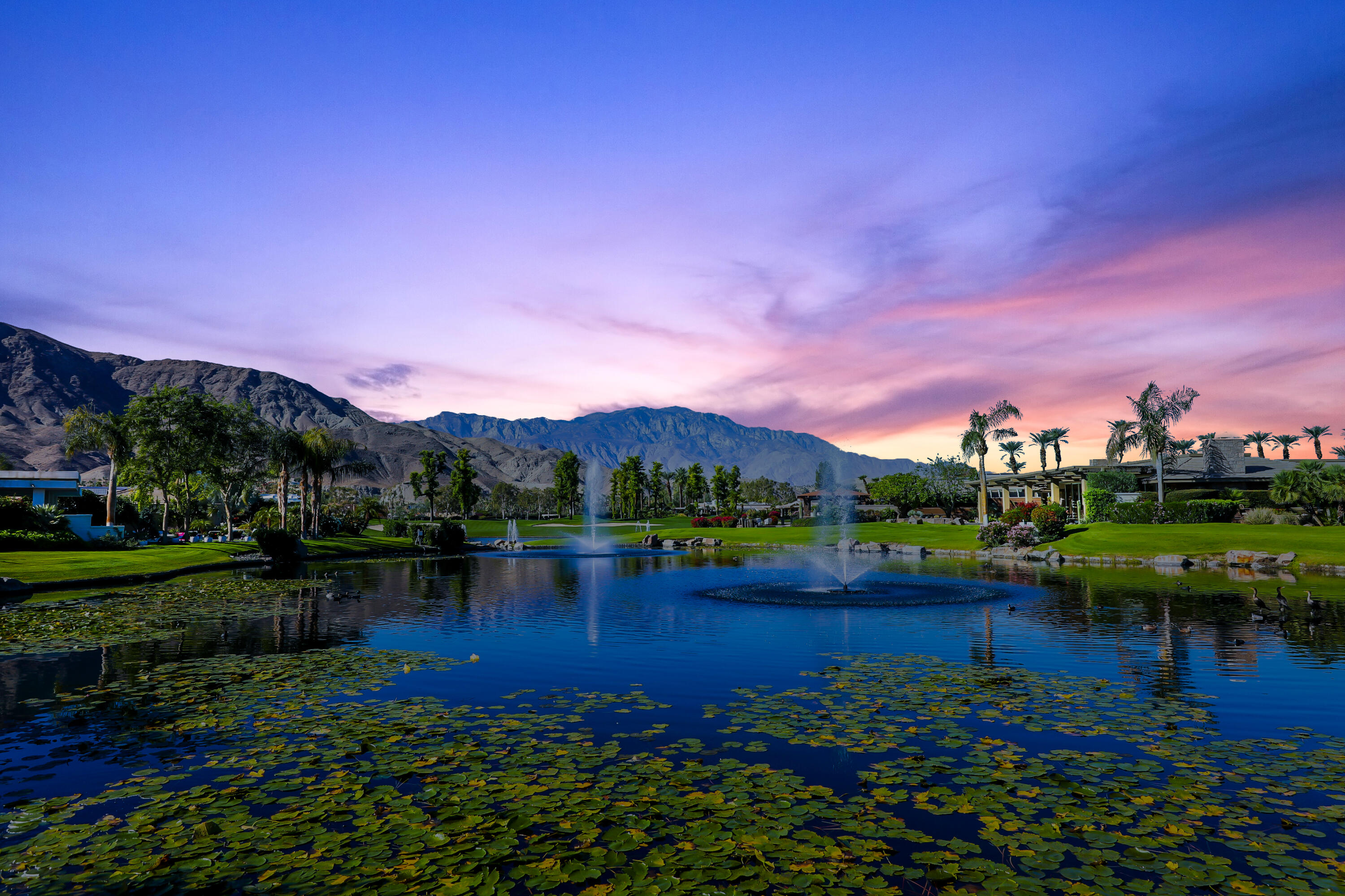 44 Fincher Way Rancho Mirage, CA 92270 - Photo 47 of 56 a view of a lake with houses in the back