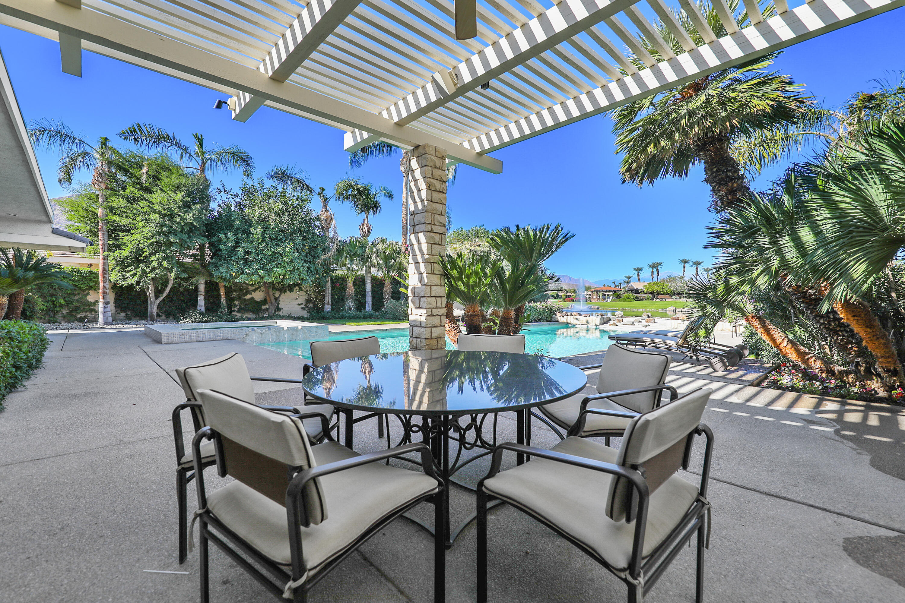 44 Fincher Way Rancho Mirage, CA 92270 - Photo 48 of 56 a view of a chairs and table in patio