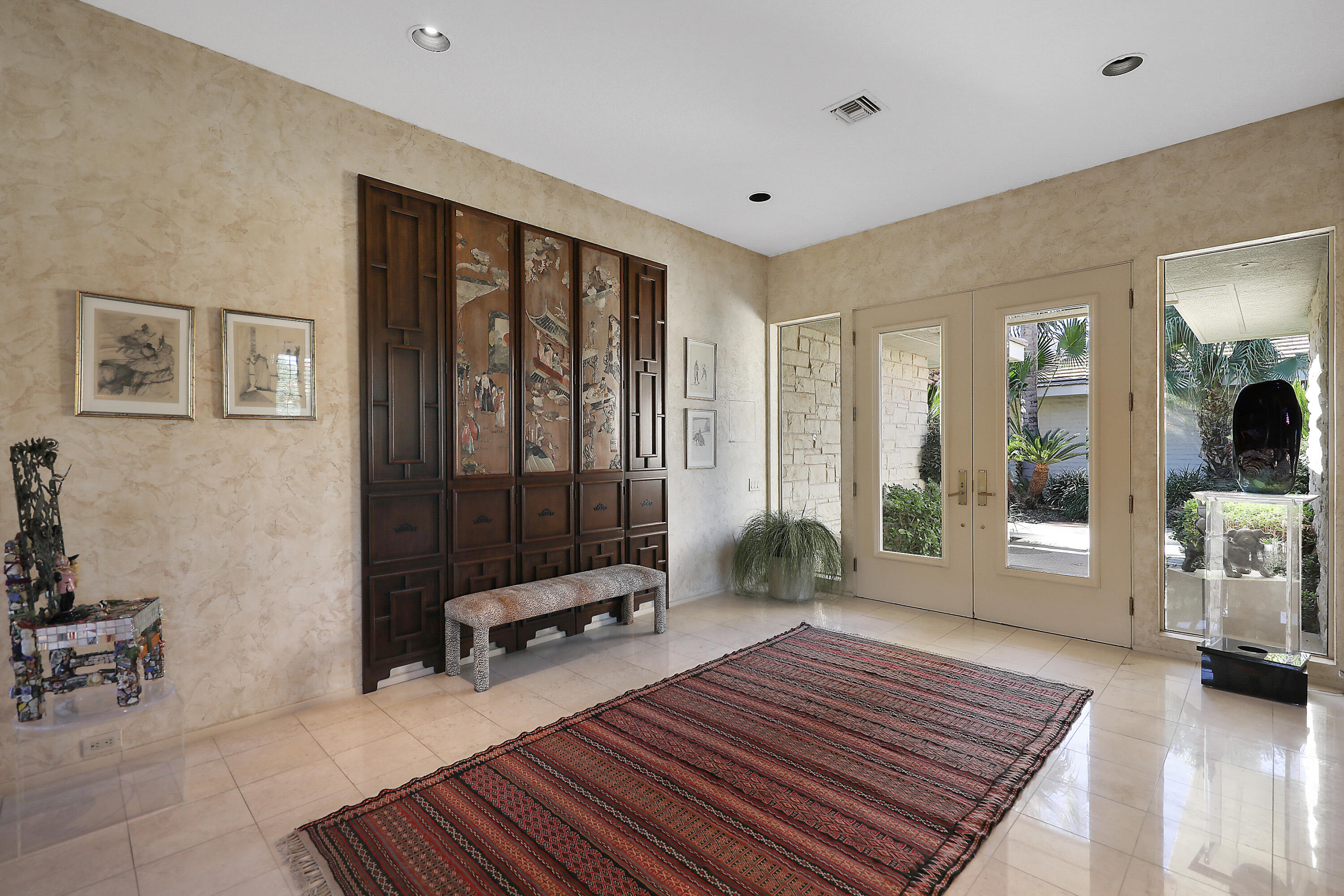44 Fincher Way Rancho Mirage, CA 92270 - Photo 8 of 56 a living room with furniture a rug and a rug