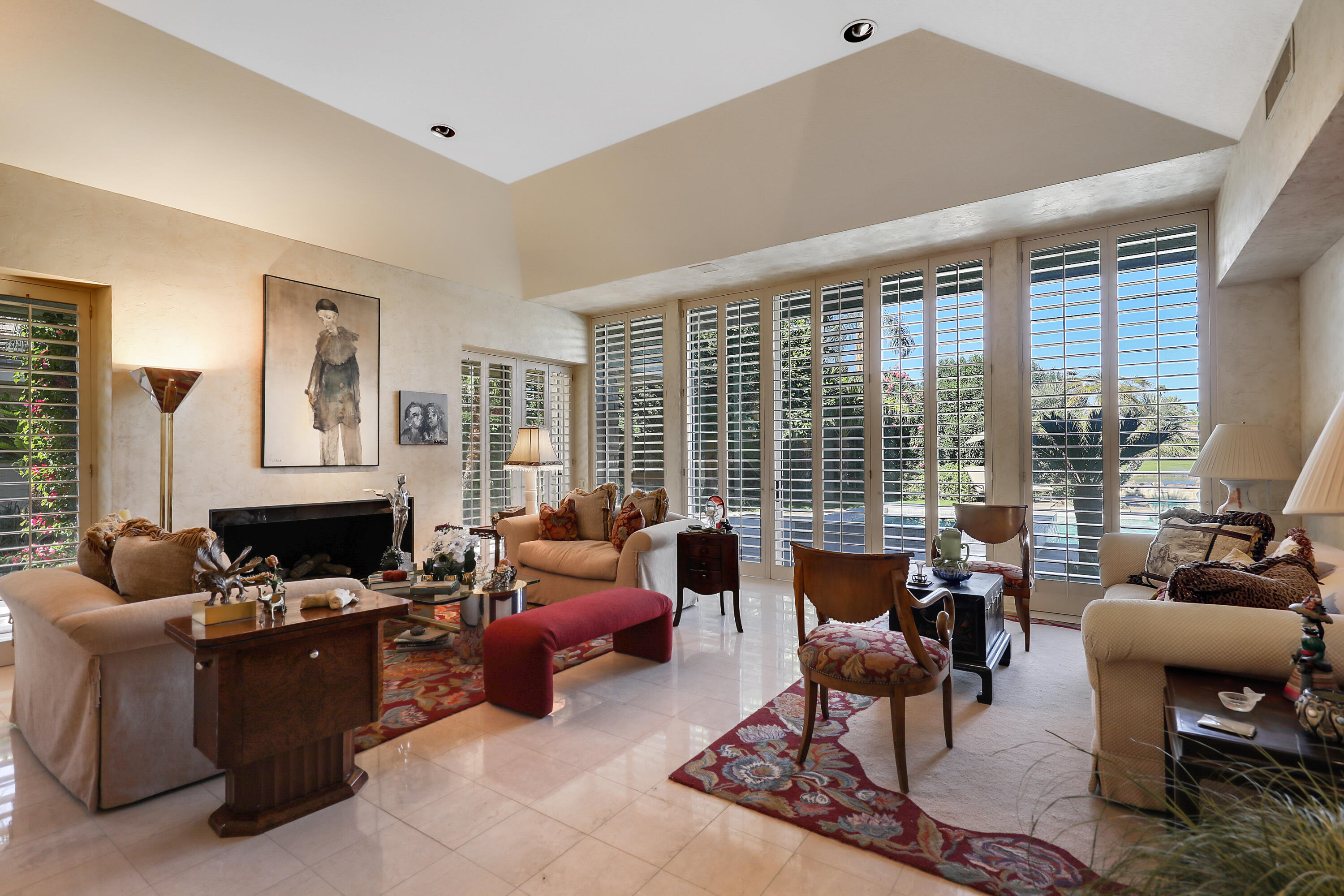 44 Fincher Way Rancho Mirage, CA 92270 - Photo 10 of 56 a living room with furniture large window and a table