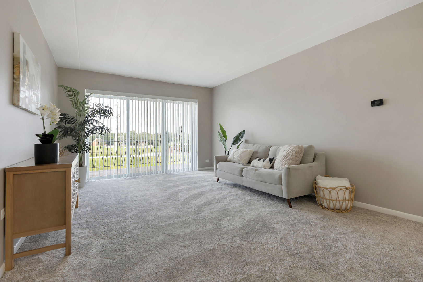 2900 Maple Avenue, Unit 17E Downers Grove, IL 60515 - Photo 4 of 19 a living room with furniture and a floor to ceiling window