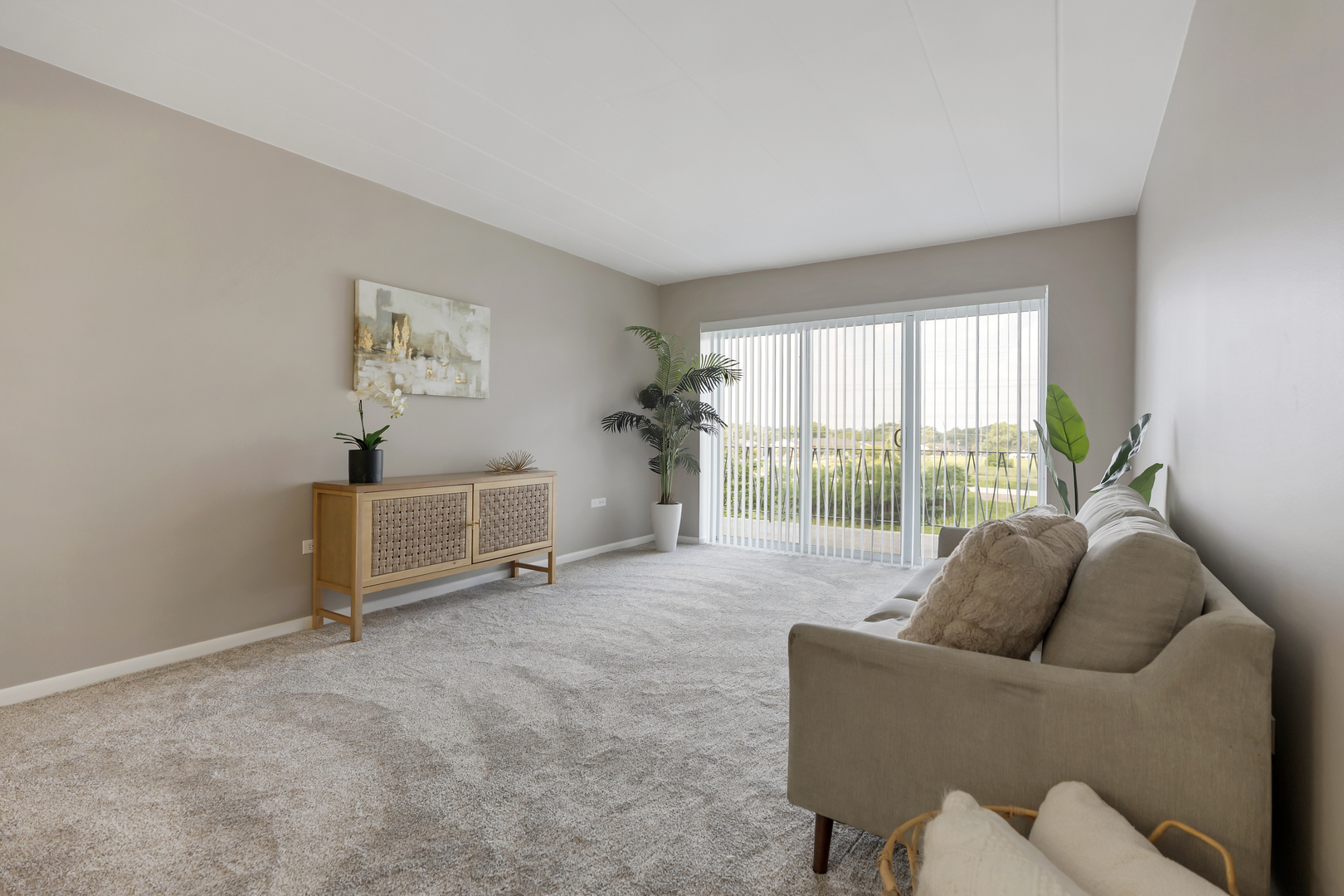 2900 Maple Avenue, Unit 17E Downers Grove, IL 60515 - Photo 6 of 19 a living room with furniture and a large window