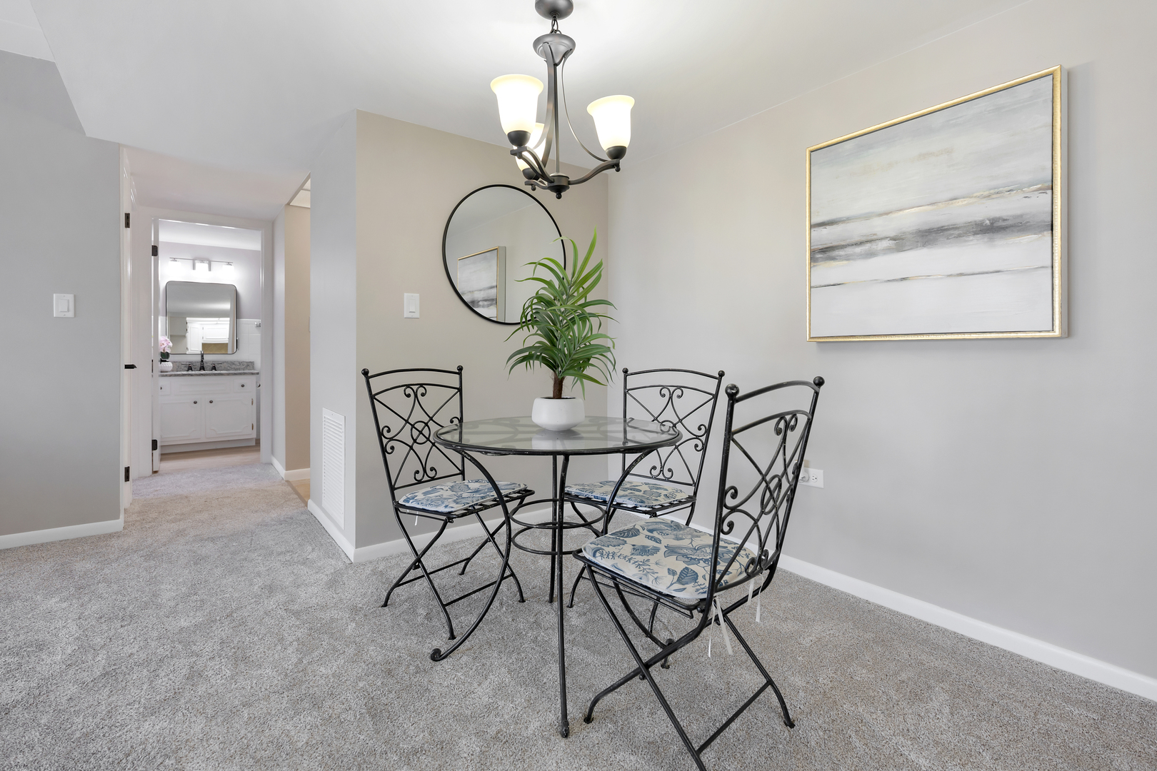 2900 Maple Avenue, Unit 17E Downers Grove, IL 60515 - Photo 8 of 19 a view of a dining room with furniture and a chandelier