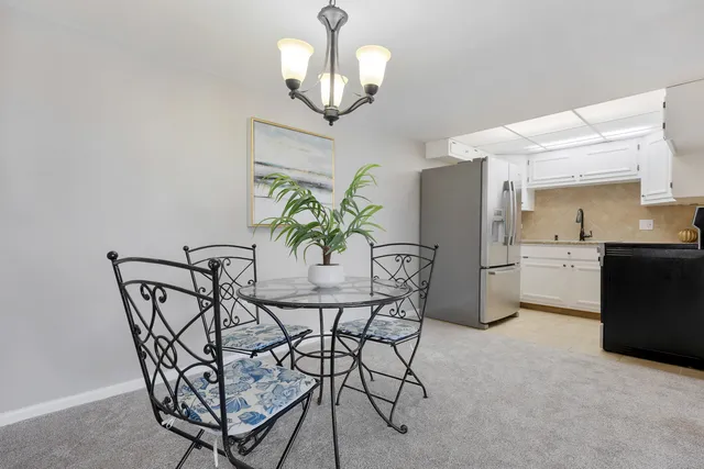 a kitchen with stainless steel appliances a refrigerator sink and cabinets