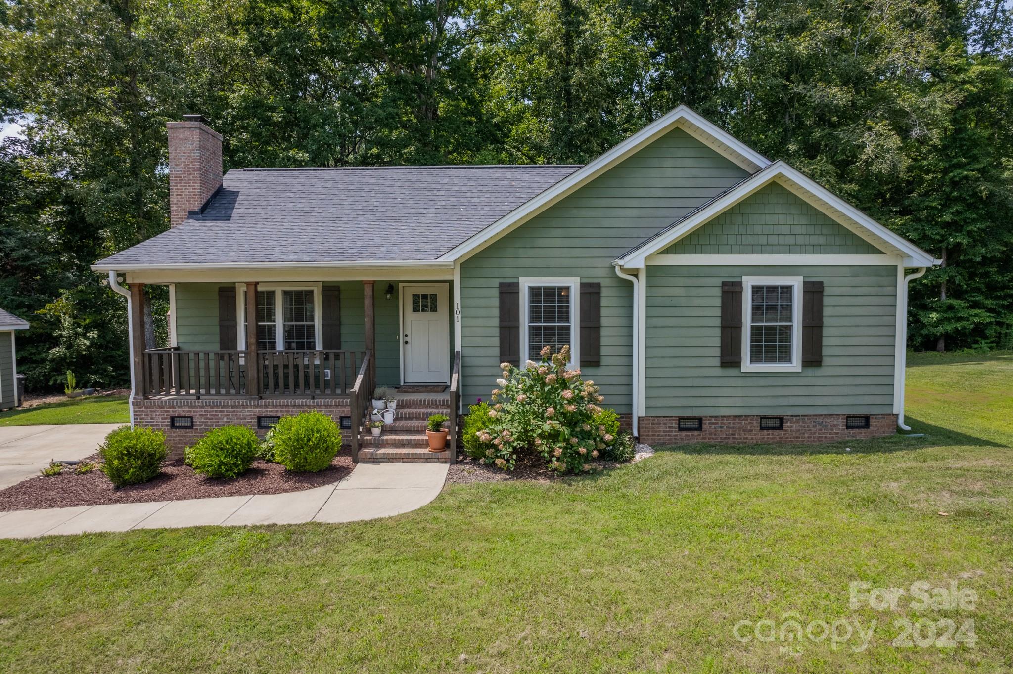 101 North Lane Road Mount Holly, NC 28120 - Photo 1 of 33 a view of a house with a yard and plants