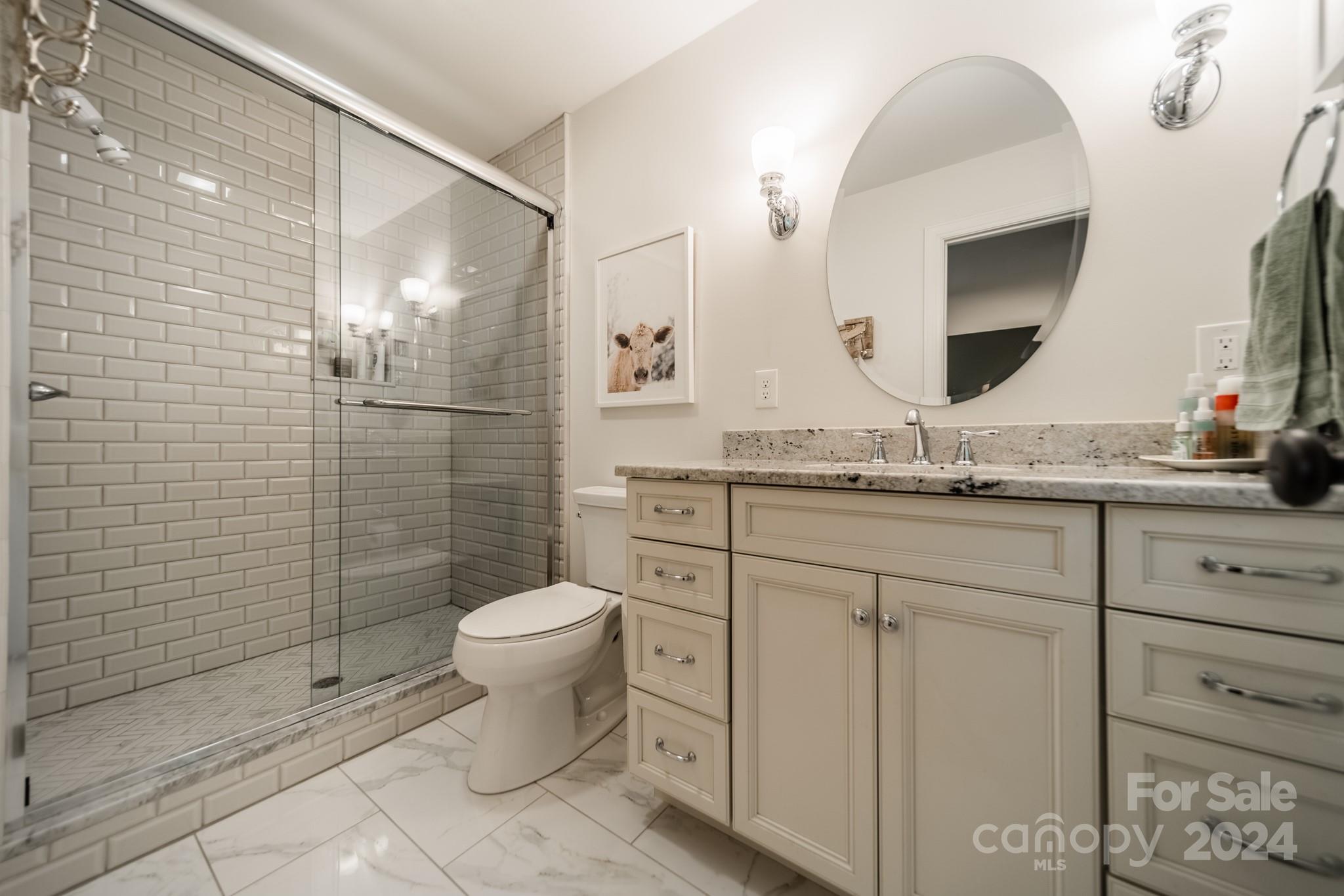 101 North Lane Road Mount Holly, NC 28120 - Photo 11 of 33 a bathroom with a granite countertop toilet sink and mirror