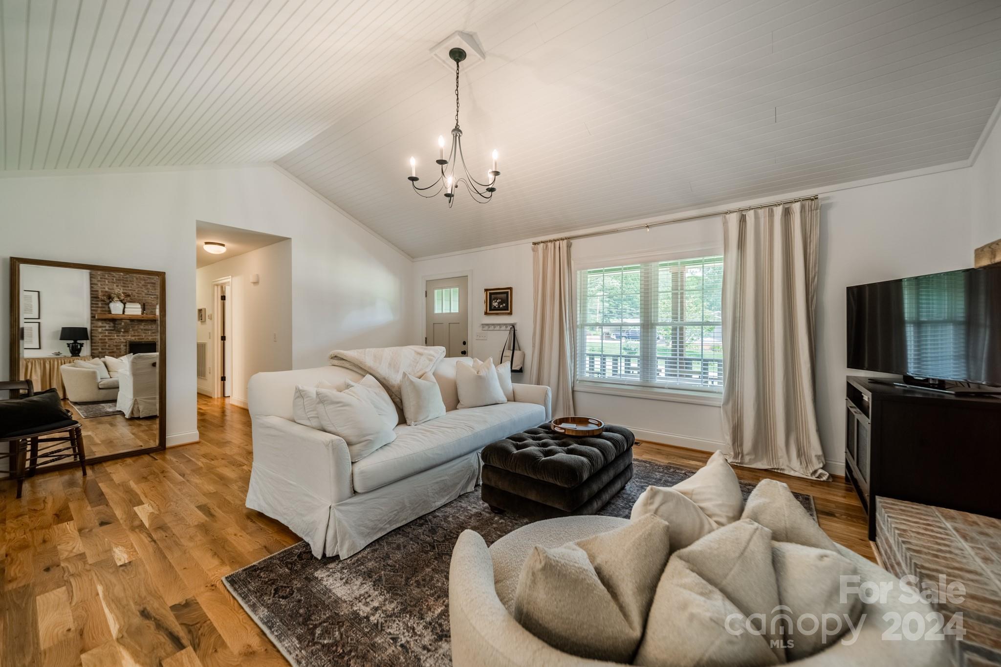 101 North Lane Road Mount Holly, NC 28120 - Photo 14 of 33 a living room with furniture or couch and a flat screen tv