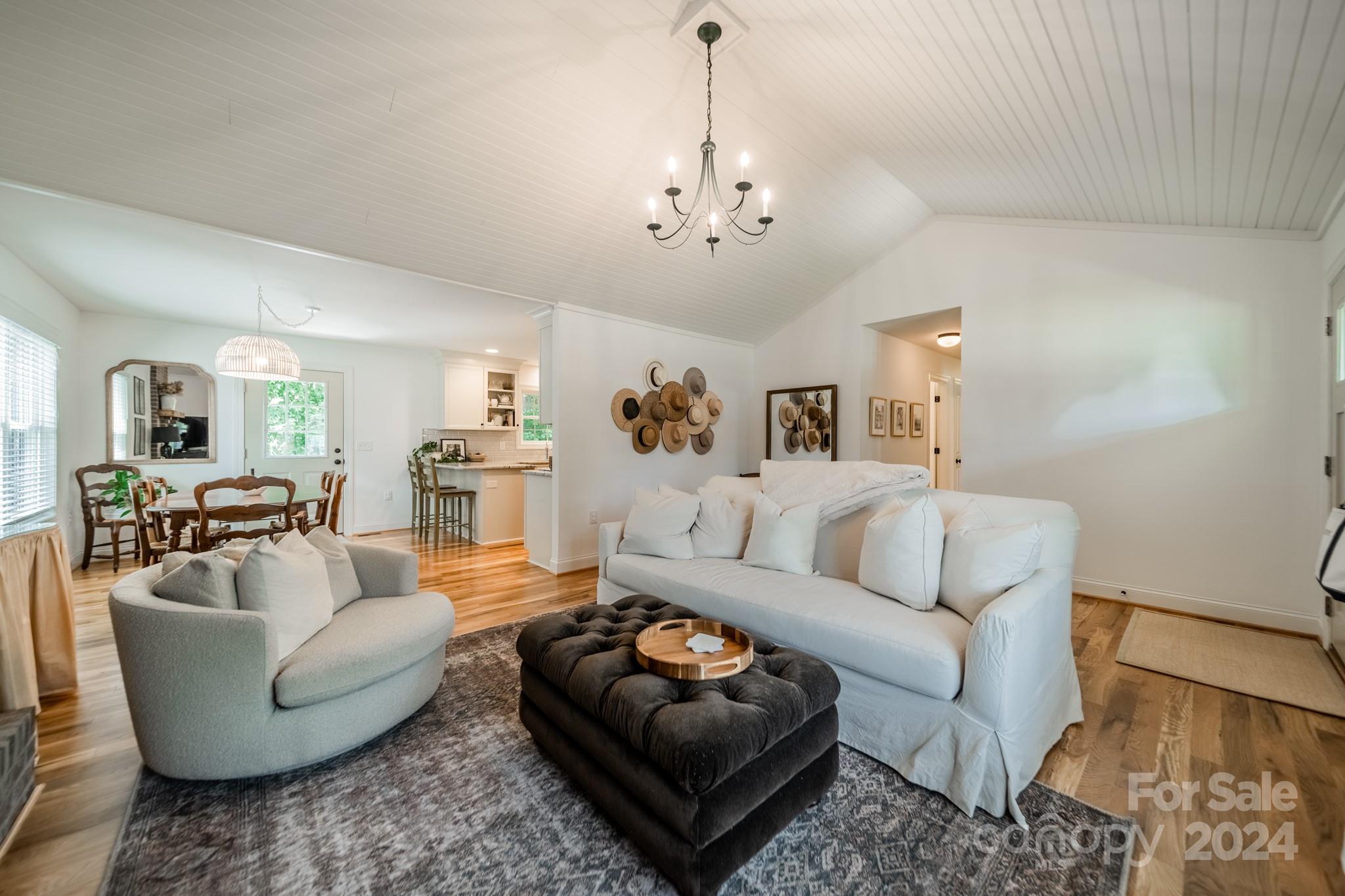 101 North Lane Road Mount Holly, NC 28120 - Photo 15 of 33 a living room with furniture a rug and a chandelier