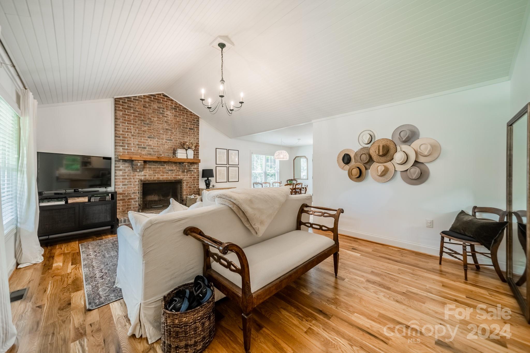 101 North Lane Road Mount Holly, NC 28120 - Photo 17 of 33 a living room with furniture and a flat screen tv