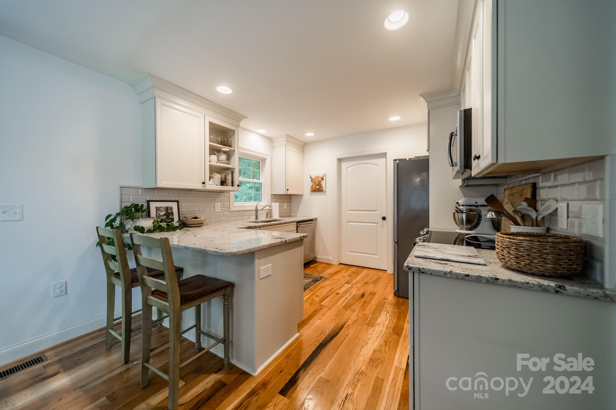 101 North Lane Road Mount Holly, NC 28120 - Photo 19 of 33 a kitchen with kitchen island a sink stove and refrigerator