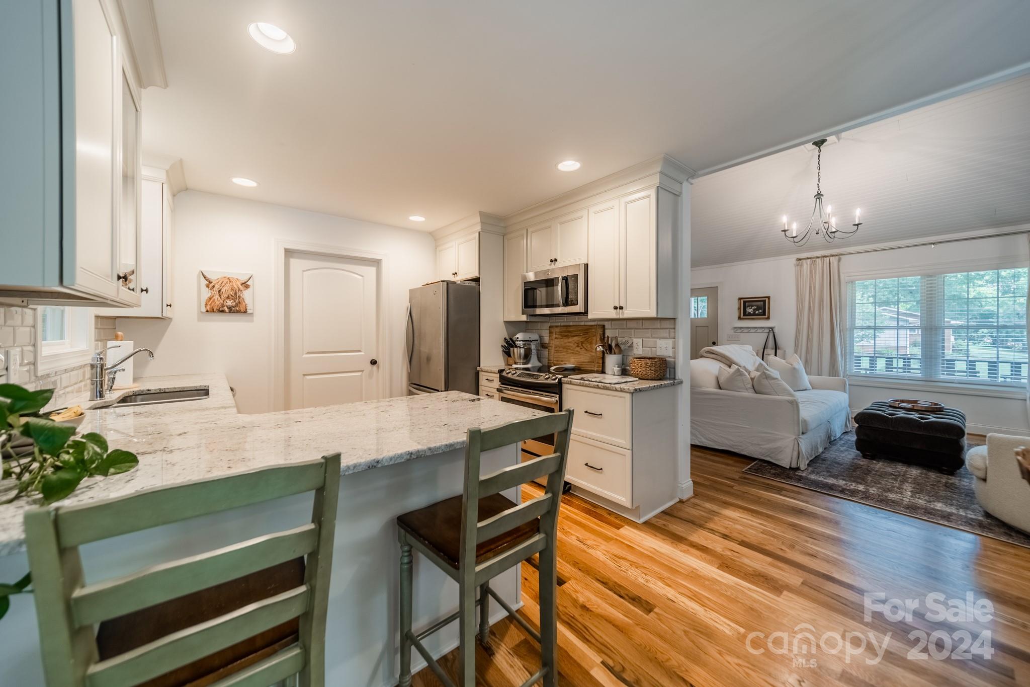 101 North Lane Road Mount Holly, NC 28120 - Photo 20 of 33 a kitchen with a refrigerator and a stove top oven