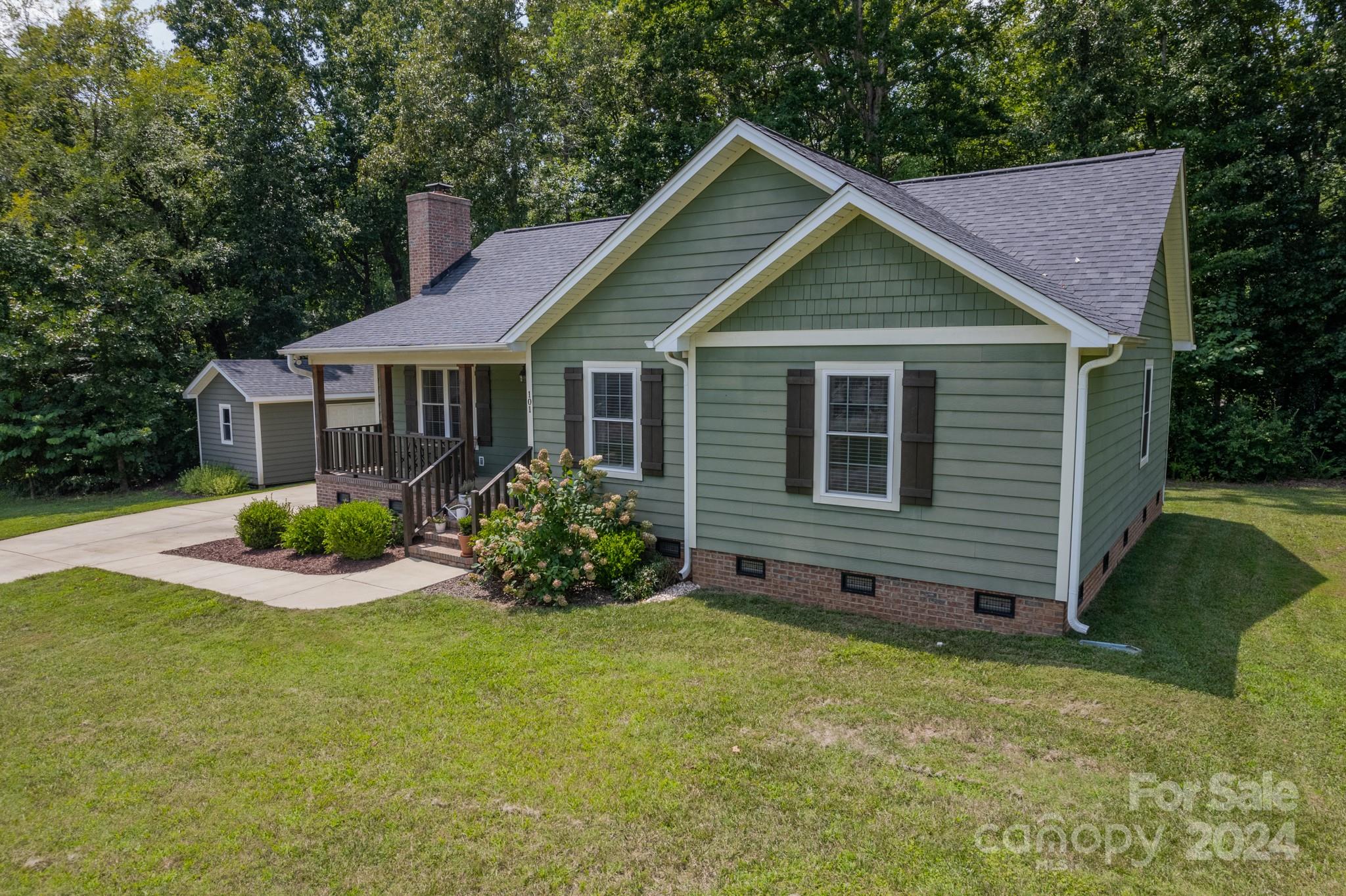 101 North Lane Road Mount Holly, NC 28120 - Photo 2 of 33 a view of a house with a yard and plants