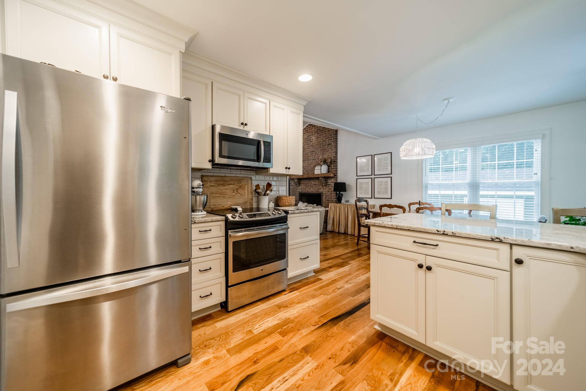 101 North Lane Road Mount Holly, NC 28120 - Photo 21 of 33 a kitchen with stainless steel appliances a refrigerator sink and microwave