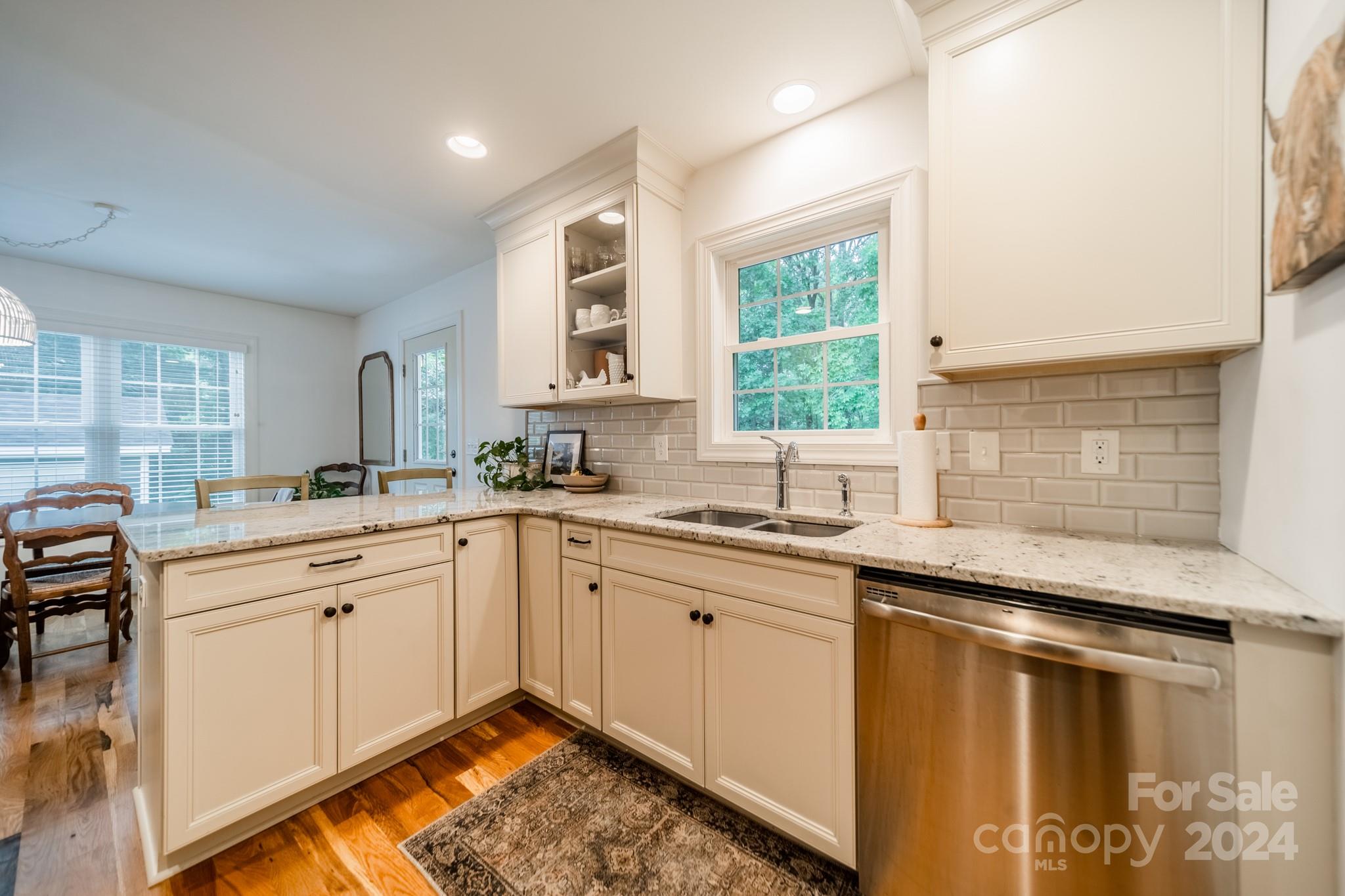 101 North Lane Road Mount Holly, NC 28120 - Photo 22 of 33 a kitchen with granite countertop a sink window and cabinets