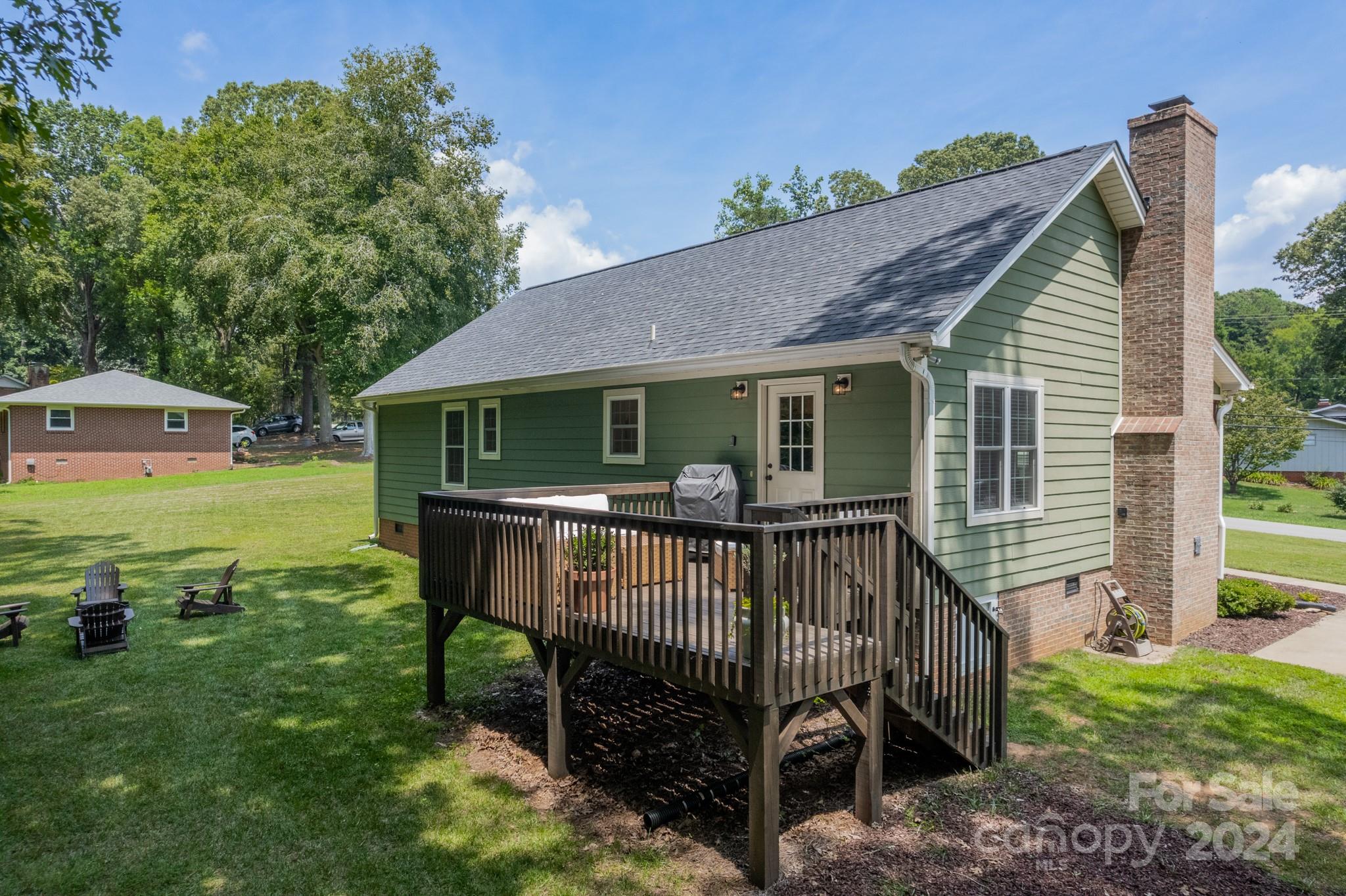 101 North Lane Road Mount Holly, NC 28120 - Photo 25 of 33 a view of a house with backyard and a hammock